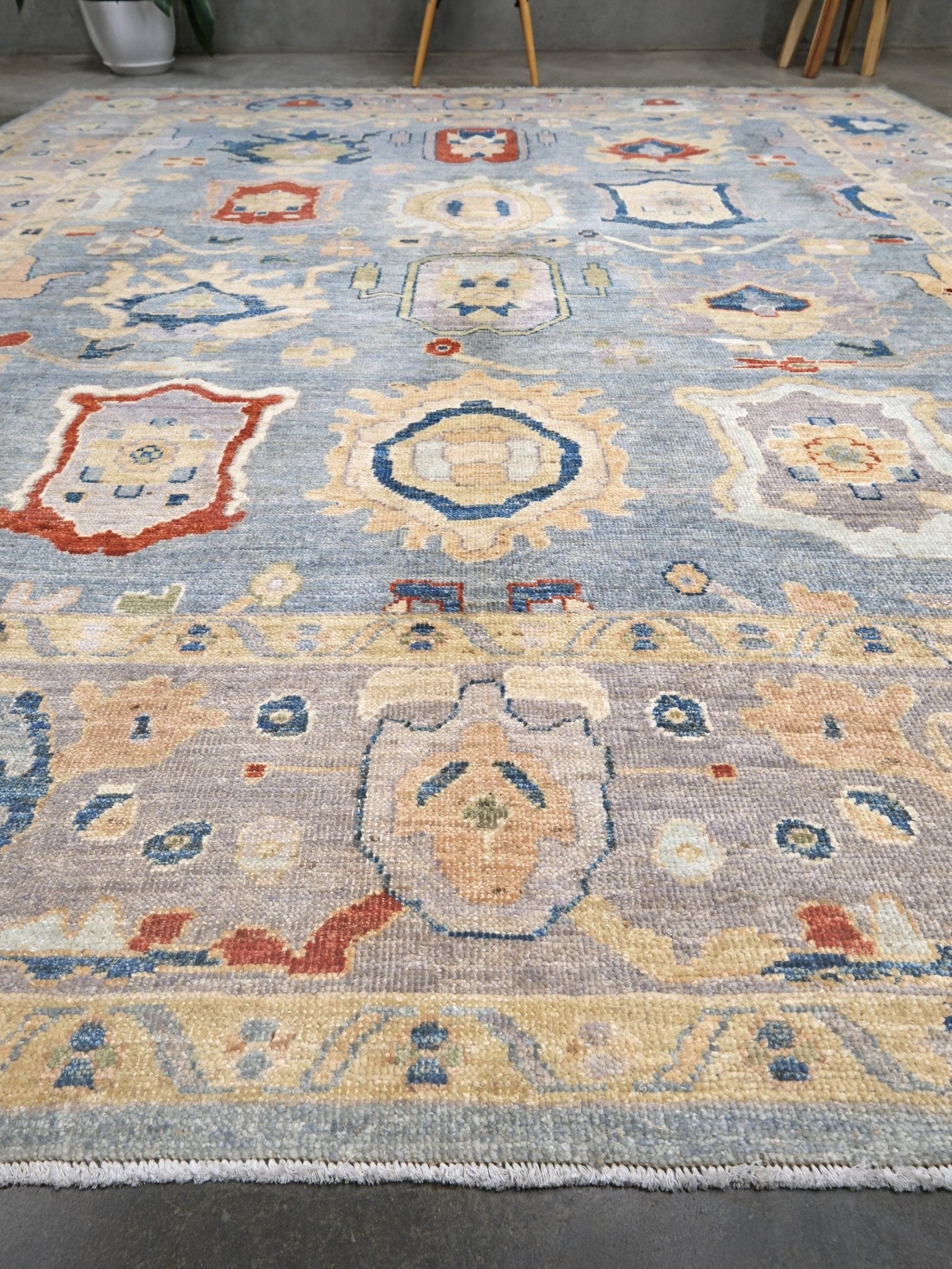 Powder blue Turkish Oushak rug with pale lavender border, warm ivory floral motifs, hand-knotted wool area rug 8x10 from Indigo Rugs Burlingame Bay Area.