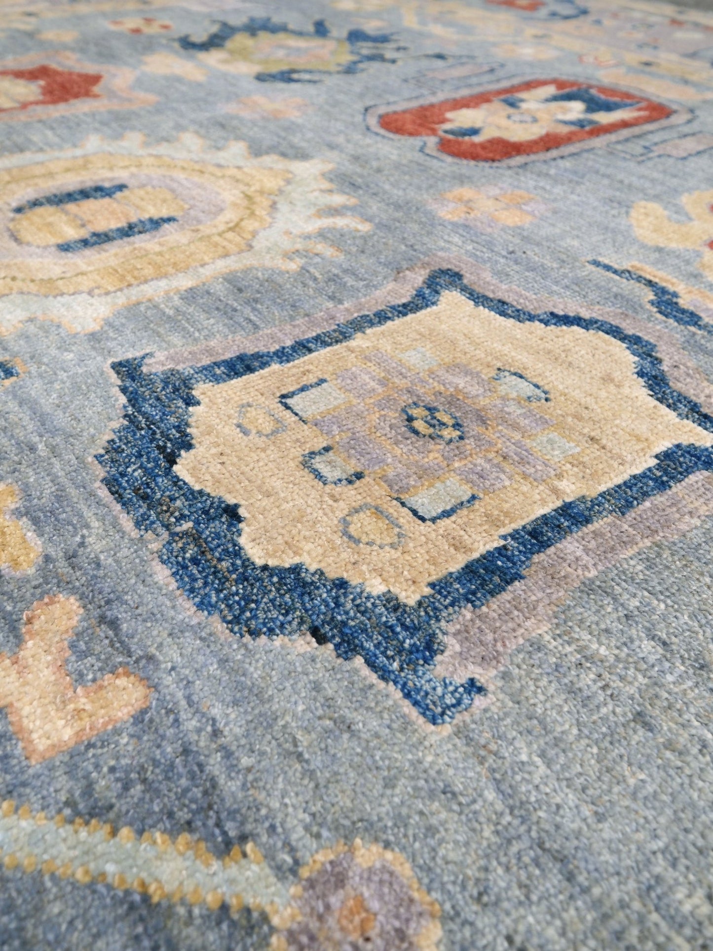 Powder blue Turkish Oushak rug with pale lavender border, warm ivory floral motifs, hand-knotted wool area rug 8x10 from Indigo Rugs Burlingame Bay Area.