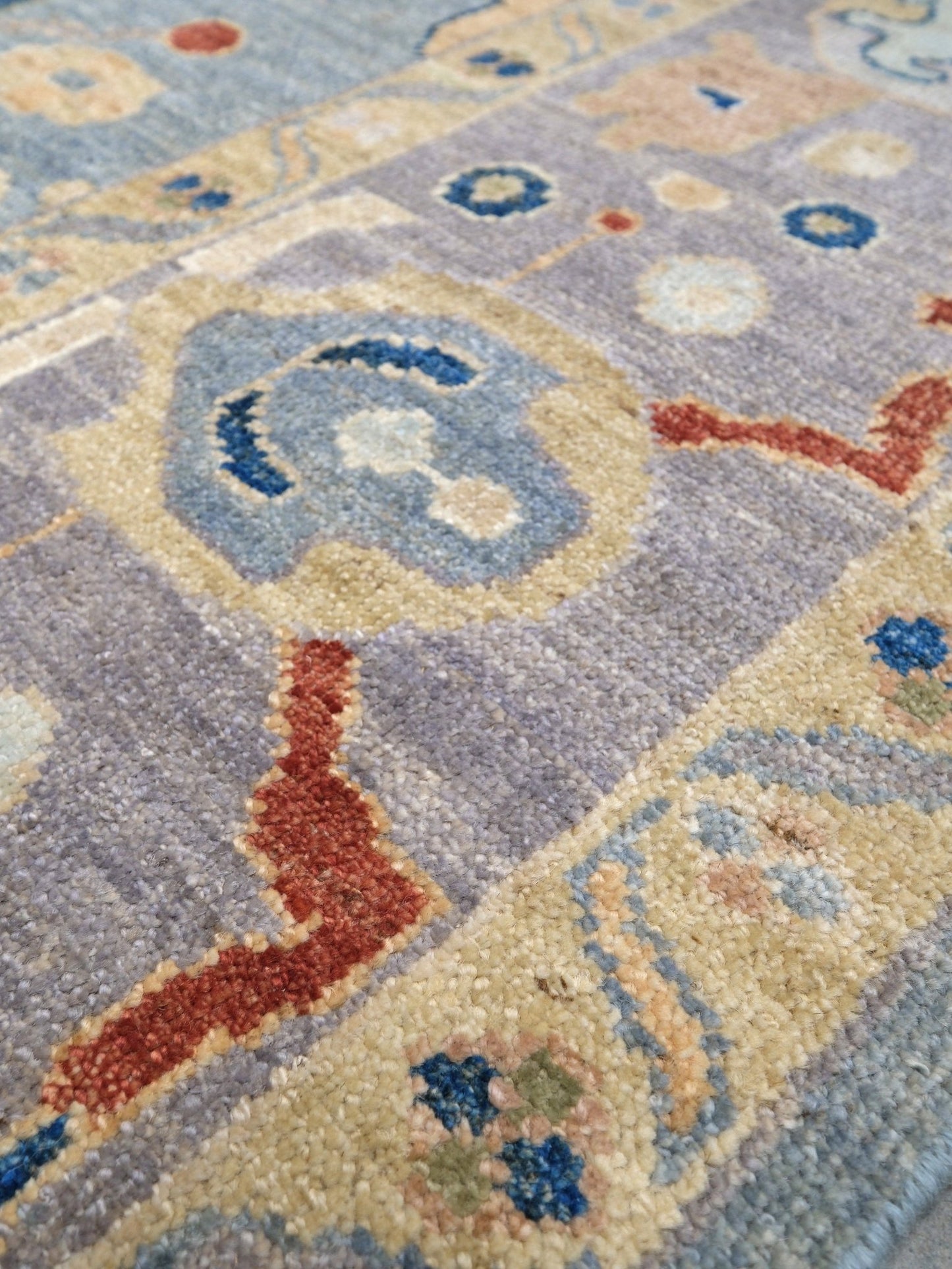 Powder blue Turkish Oushak rug with pale lavender border, warm ivory floral motifs, hand-knotted wool area rug 8x10 from Indigo Rugs Burlingame Bay Area.