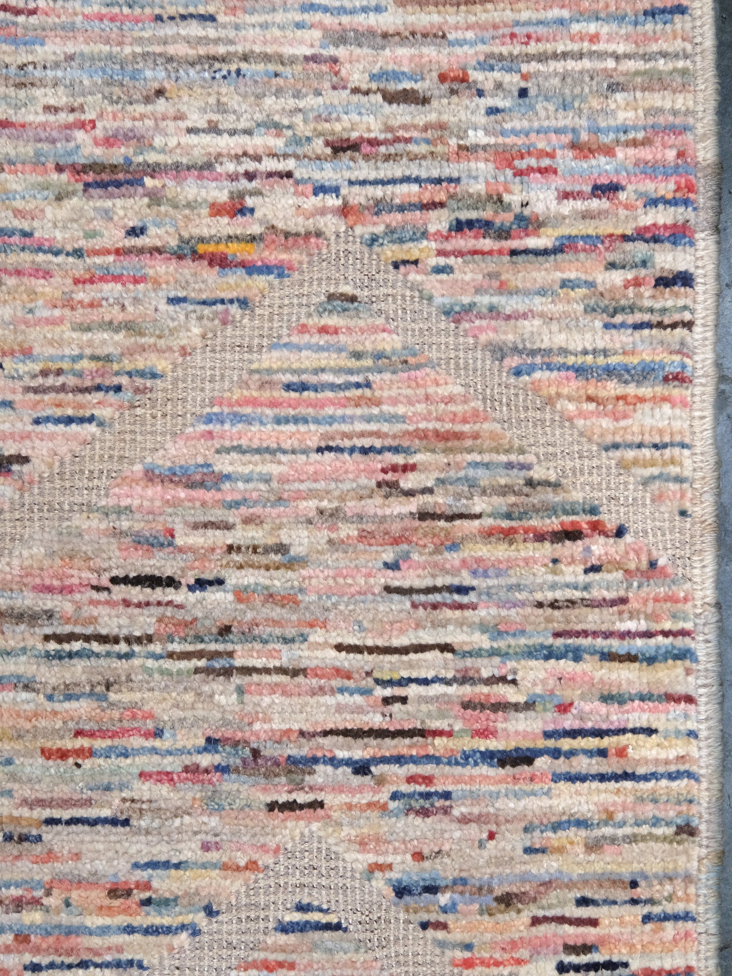 Painterly pastel  6x9 Turkish Tulu rug with raised geometric triangle pattern in ivory, oatmeal beige, blush pink, taupe, handmade textured wool from Indigo Rugs Burlingame Bay Area.