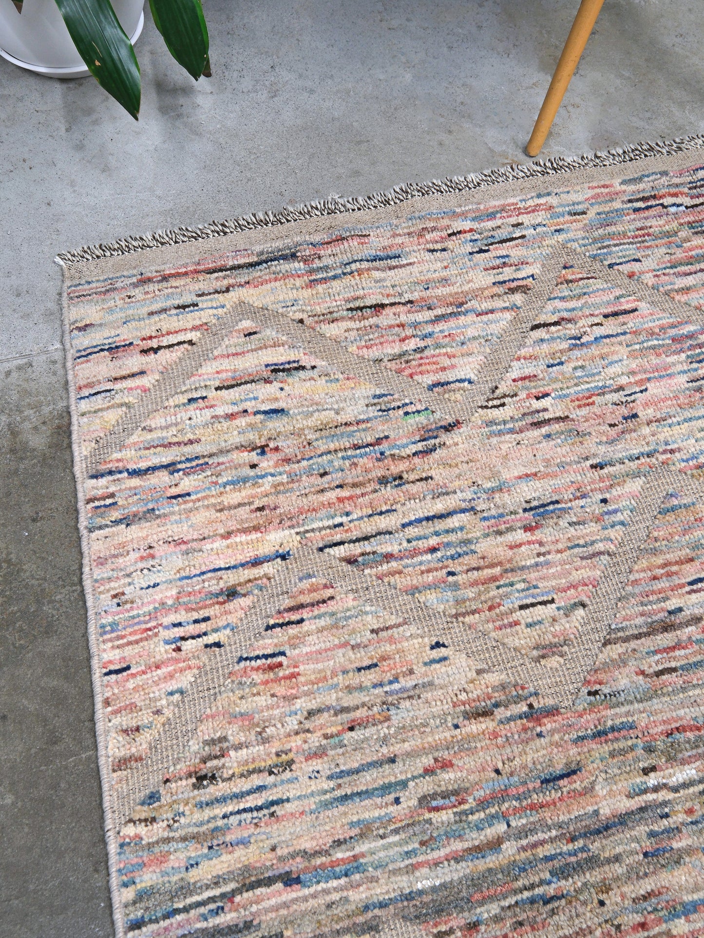 Painterly pastel  6x9 Turkish Tulu rug with raised geometric triangle pattern in ivory, oatmeal beige, blush pink, taupe, handmade textured wool from Indigo Rugs Burlingame Bay Area.