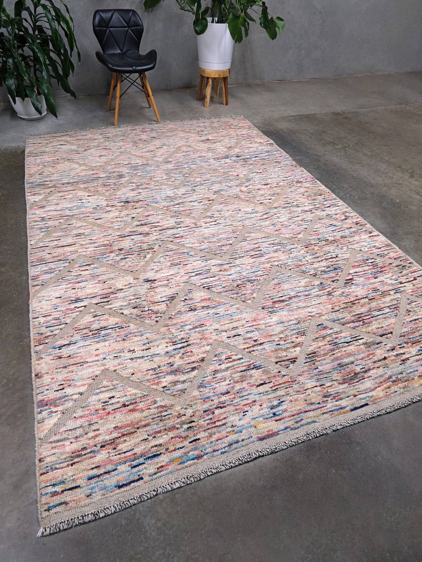 Painterly pastel  6x9 Turkish Tulu rug with raised geometric triangle pattern in ivory, oatmeal beige, blush pink, taupe, handmade textured wool from Indigo Rugs Burlingame Bay Area.