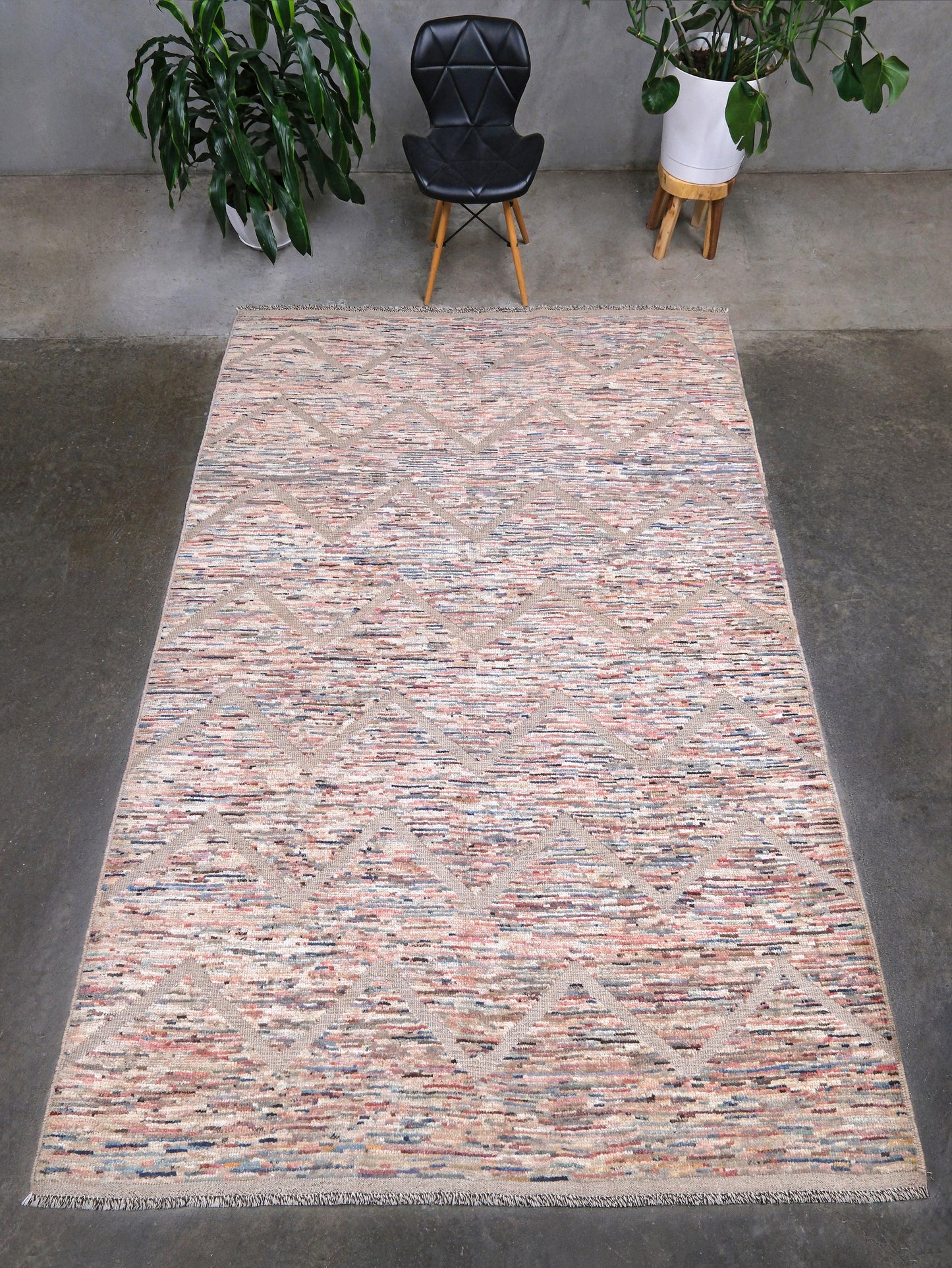 Painterly pastel  6x9 Turkish Tulu rug with raised geometric triangle pattern in ivory, oatmeal beige, blush pink, taupe, handmade textured wool from Indigo Rugs Burlingame Bay Area.