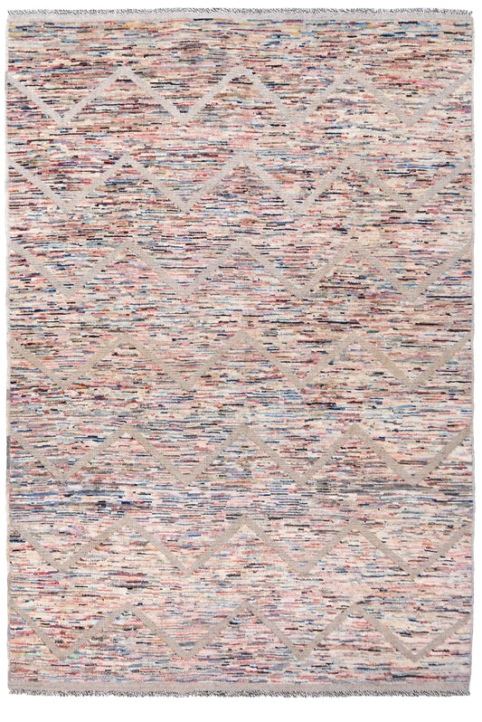 A rectangular woven area rug with a textured, multicolor pattern of pink, beige, blue, and gray threads, featuring a subtle diamond lattice design and fringed edges.