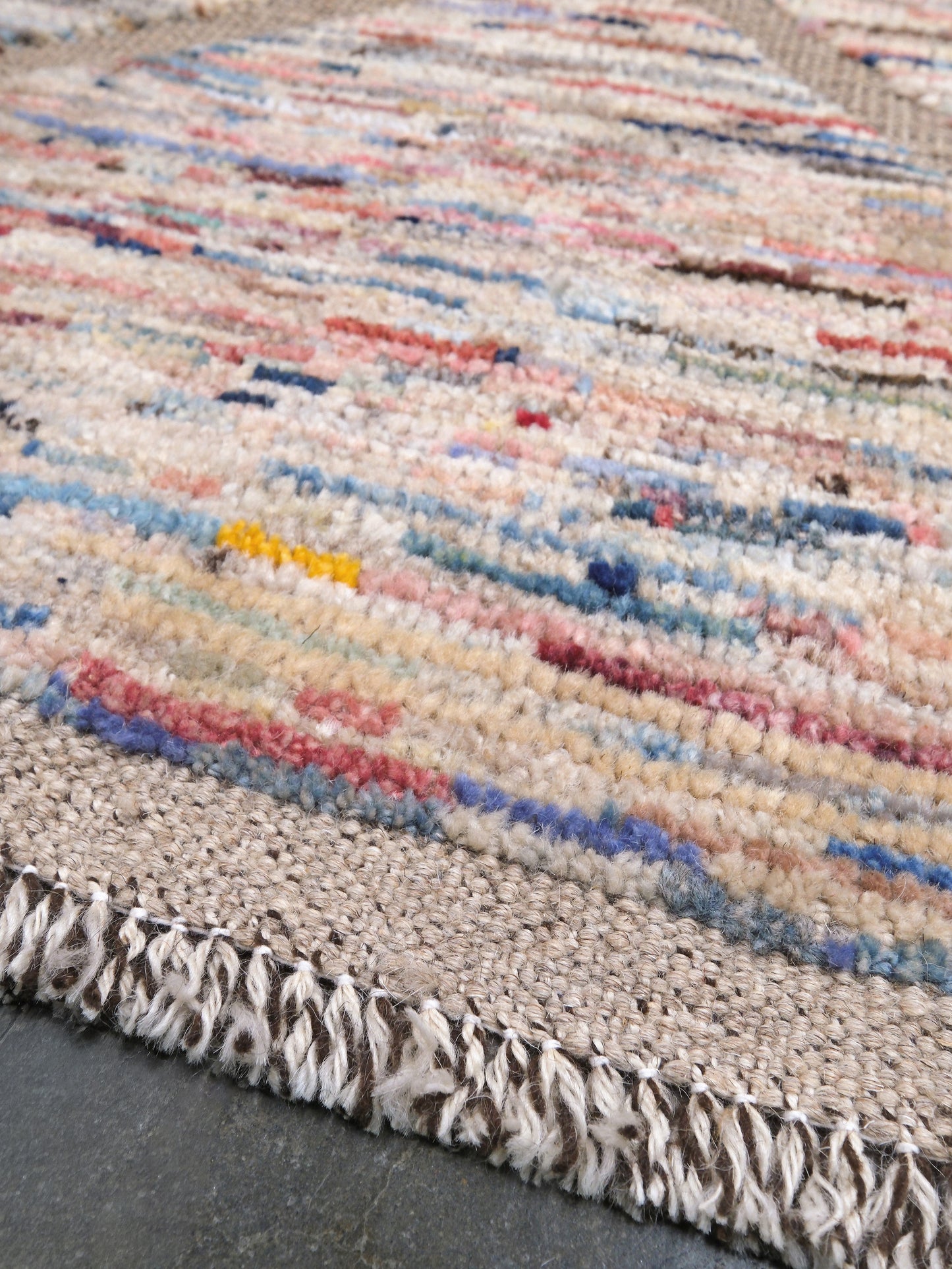 Painterly pastel  6x9 Turkish Tulu rug with raised geometric triangle pattern in ivory, oatmeal beige, blush pink, taupe, handmade textured wool from Indigo Rugs Burlingame Bay Area.