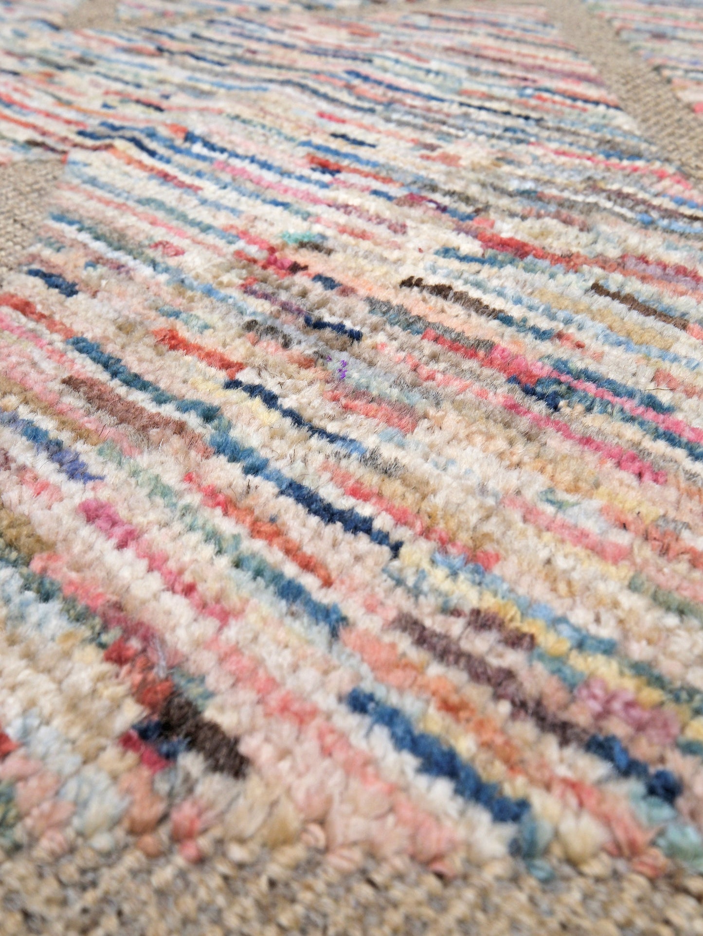 Painterly pastel  6x9 Turkish Tulu rug with raised geometric triangle pattern in ivory, oatmeal beige, blush pink, taupe, handmade textured wool from Indigo Rugs Burlingame Bay Area.