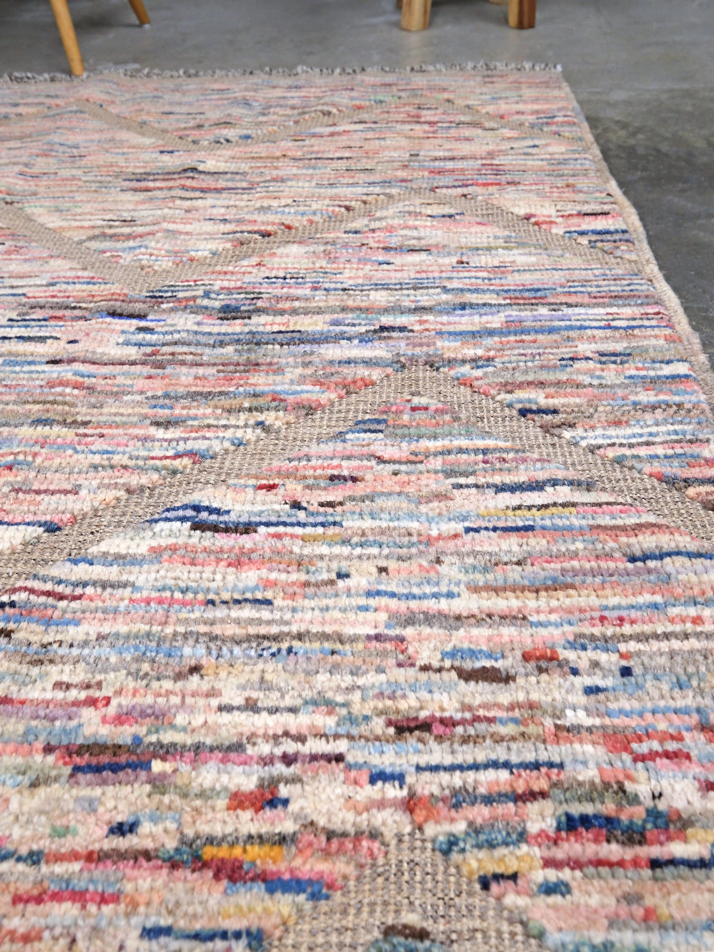 Painterly pastel  6x9 Turkish Tulu rug with raised geometric triangle pattern in ivory, oatmeal beige, blush pink, taupe, handmade textured wool from Indigo Rugs Burlingame Bay Area.