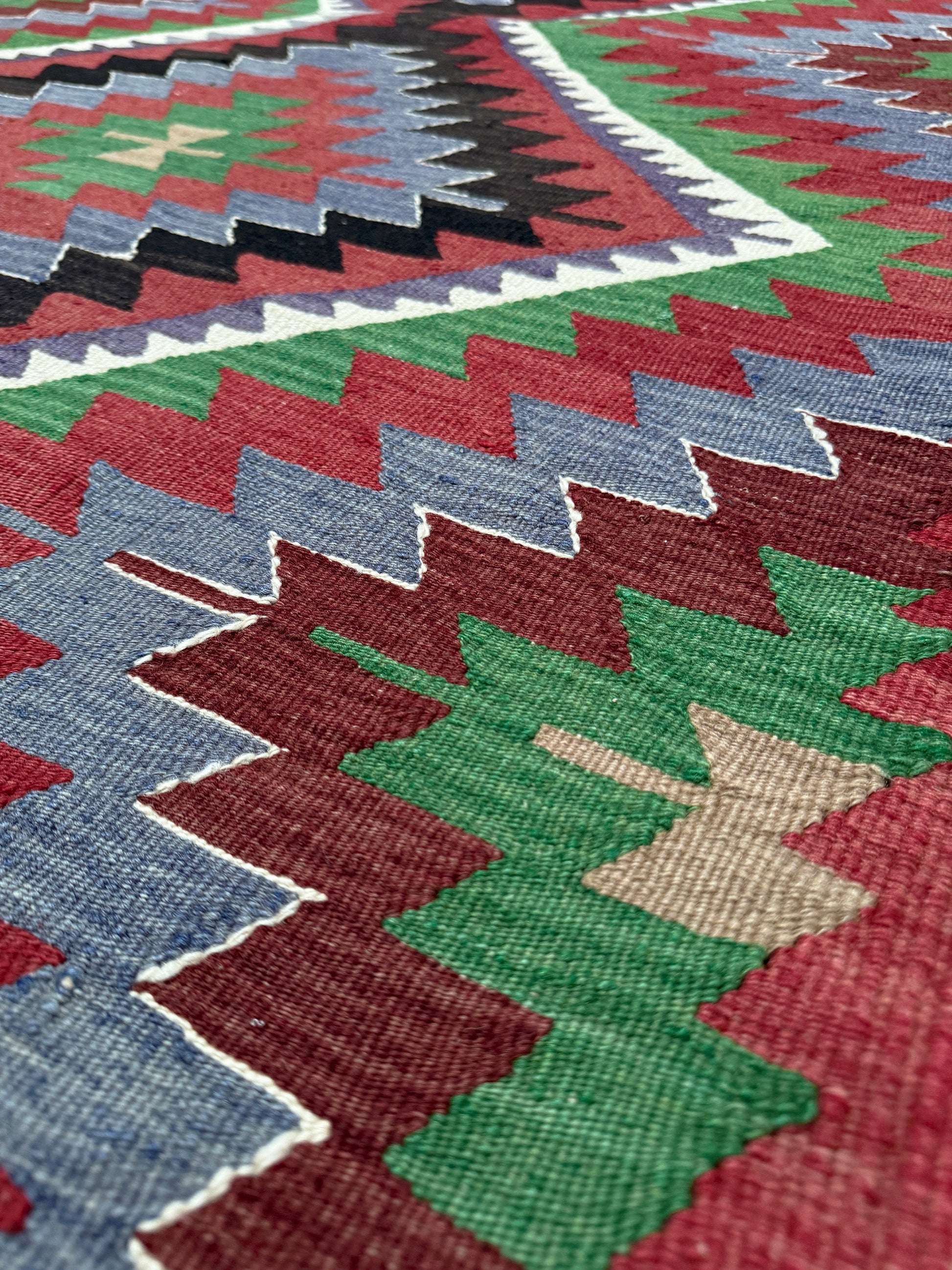 Vintage Esme Turkish kilim featuring navajo style geometric design, handwoven wool flatweave rug 6x9