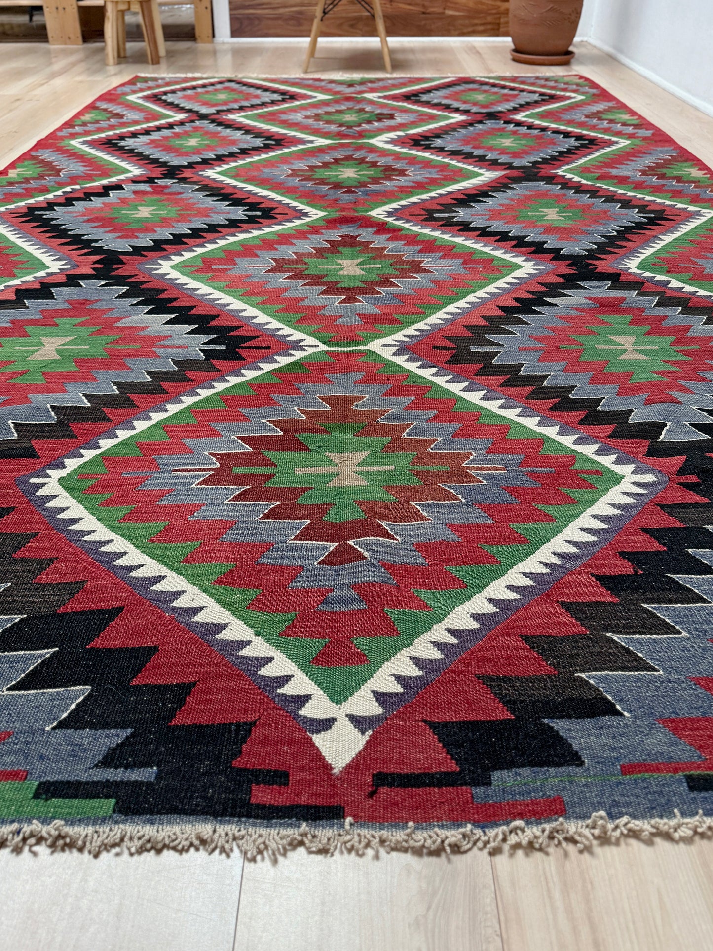 Vintage Esme Turkish kilim featuring navajo style geometric design, handwoven wool flatweave rug 6x9