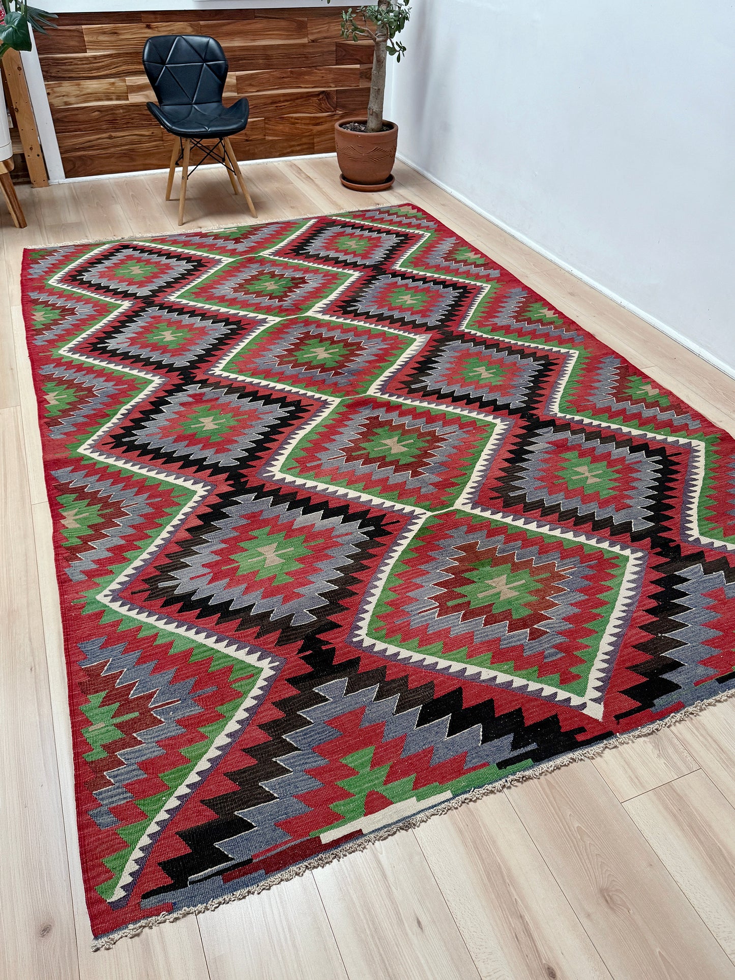 Vintage Esme Turkish kilim featuring navajo style geometric design, handwoven wool flatweave rug 6x9