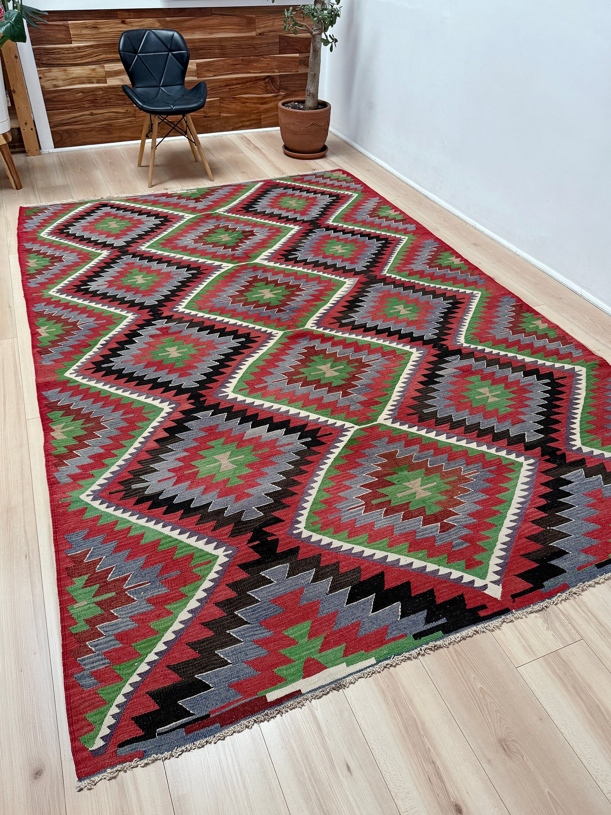 Vintage Esme Turkish kilim featuring navajo style geometric design, handwoven wool flatweave rug 6x9