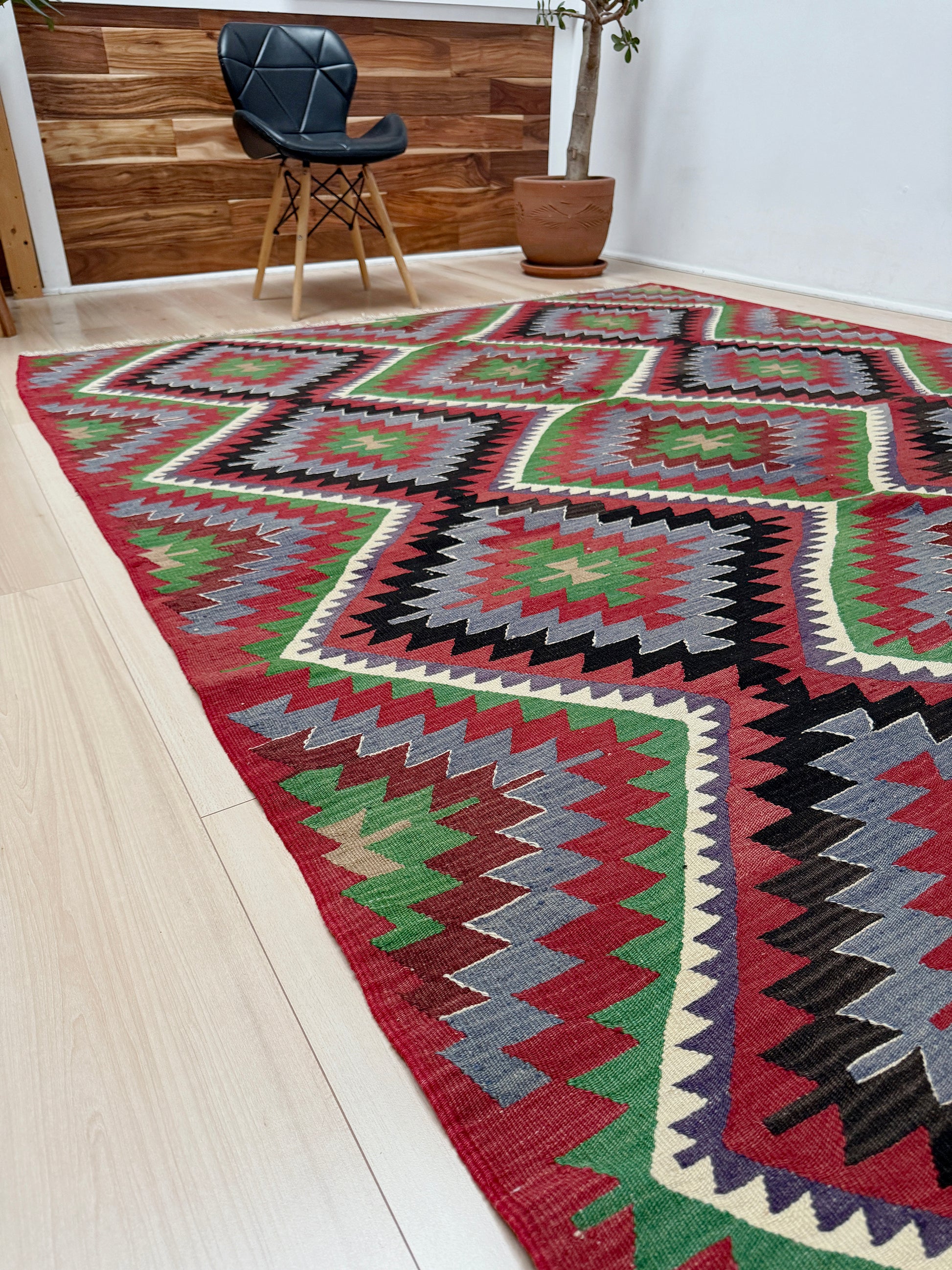 Vintage Esme Turkish kilim featuring navajo style geometric design, handwoven wool flatweave rug 6x9