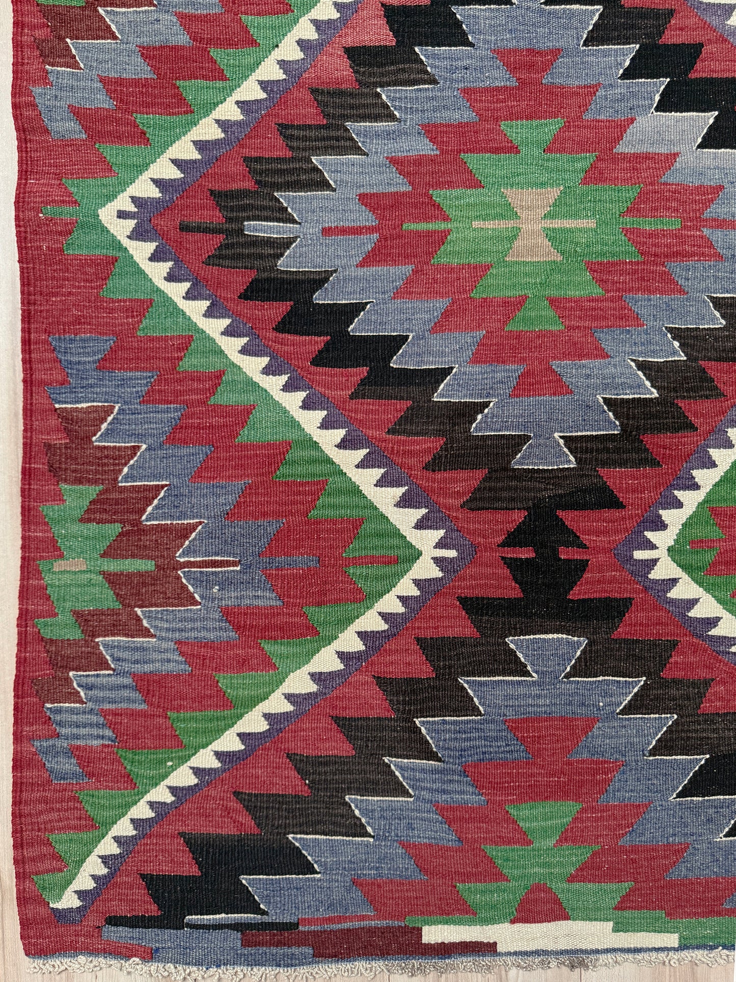 Multicolored geometric patterned rug with a prominent zigzag design. Vintage Esme Turkish kilim featuring navajo style geometric design, handwoven wool flatweave rug 6x9