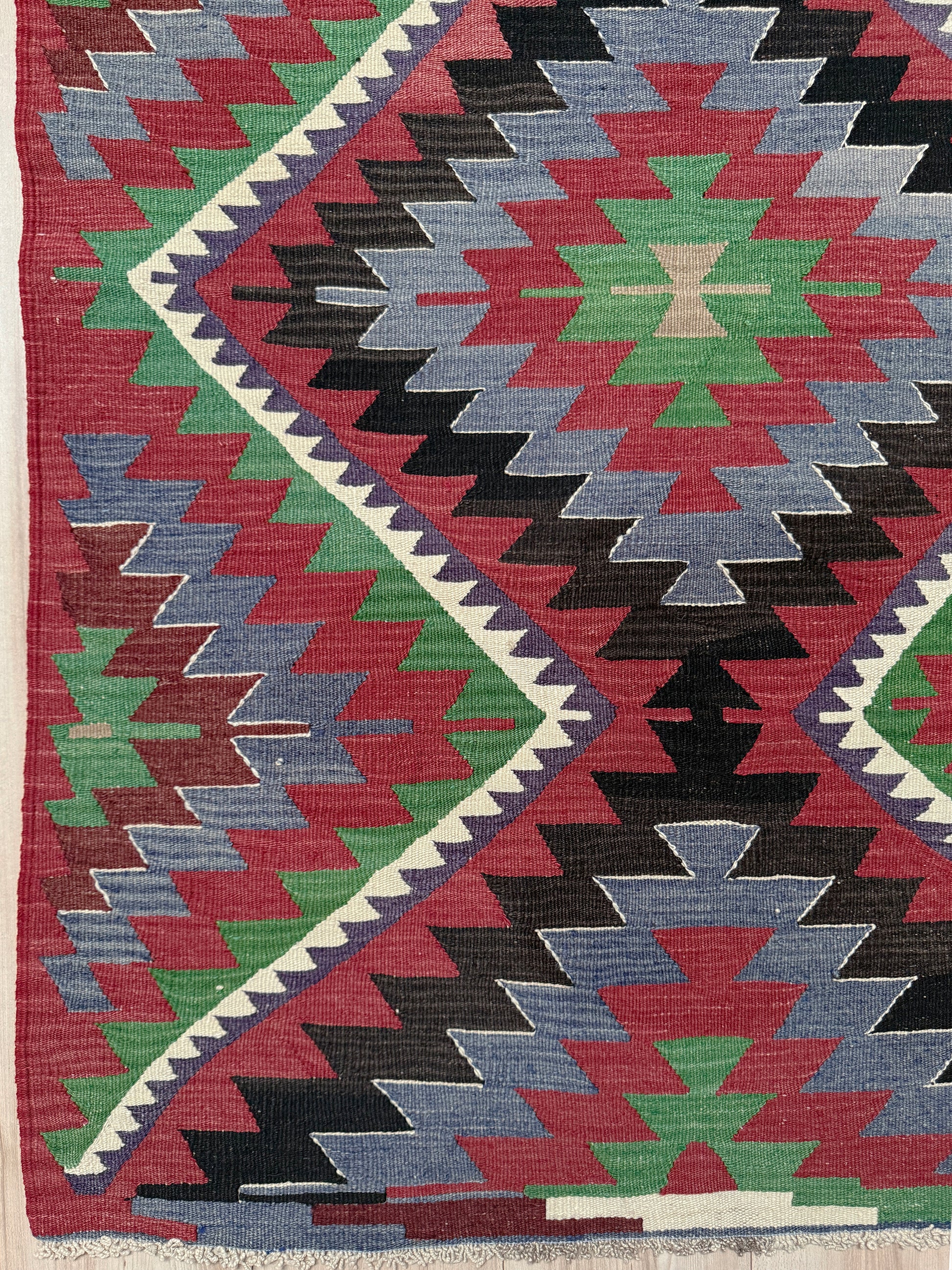 Multicolored geometric patterned rug with a prominent zigzag design. Vintage Esme Turkish kilim featuring navajo style geometric design, handwoven wool flatweave rug 6x9