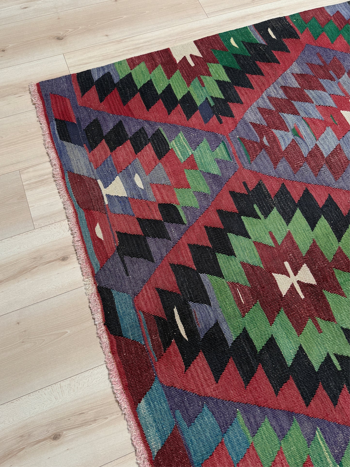 Vintage Esme Turkish tribal kilim rug featuring geometric design in raspberry red, blue violet, emerald green, handmade 6x10 perfect for boho style 