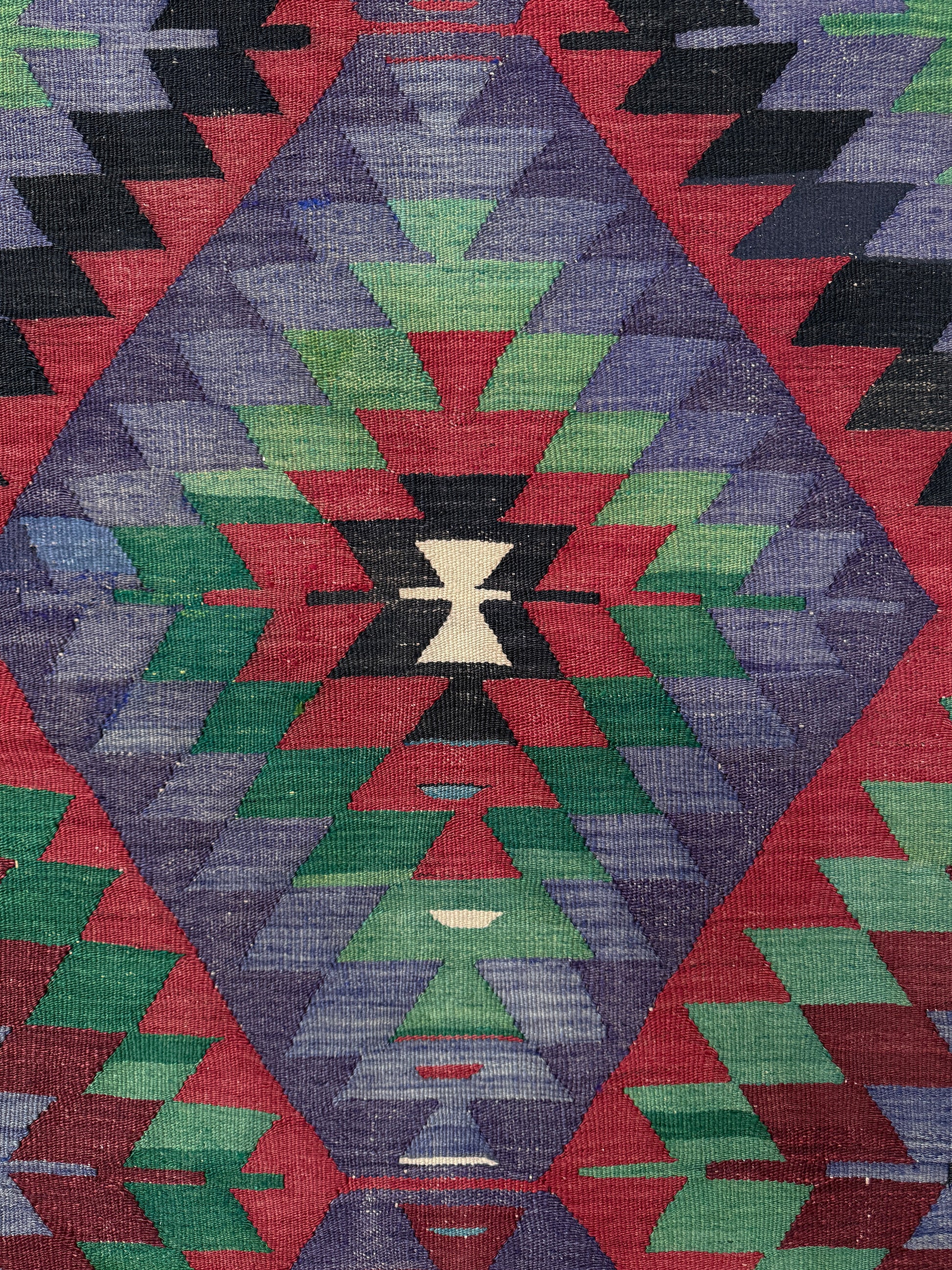 Vintage Esme Turkish tribal kilim rug featuring geometric design in raspberry red, blue violet, emerald green, handmade 6x10 perfect for boho style 