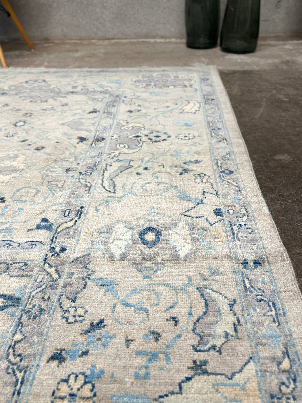 Neutral blue Oushak Turkish rug with ivory and pale blue-gray field, soft floral motifs, muted border, beige and deeper blue accents, handmade wool 8x10 from Indigo Rugs Burlingame Bay Area.