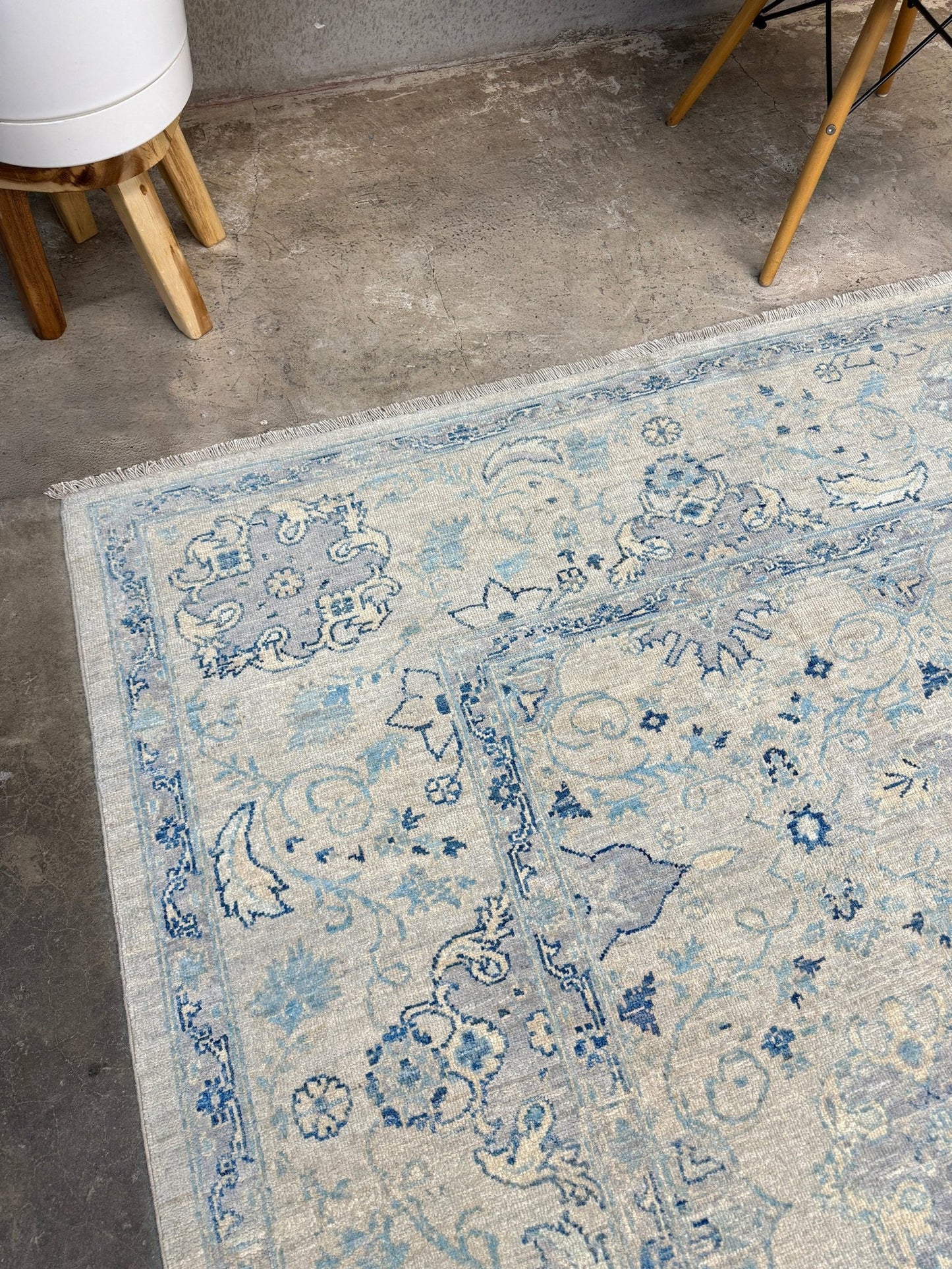 Neutral transitional handmade 8x10 decorative rug with muted gray, ivory, and layered blue tones. Soft Sultanabad-inspired floral motifs, perfect for living rooms, dining spaces, or bedrooms. Contemporary yet timeless, from a rug shop in Burlingame, San Francisco Bay Area, CA with free shipping.