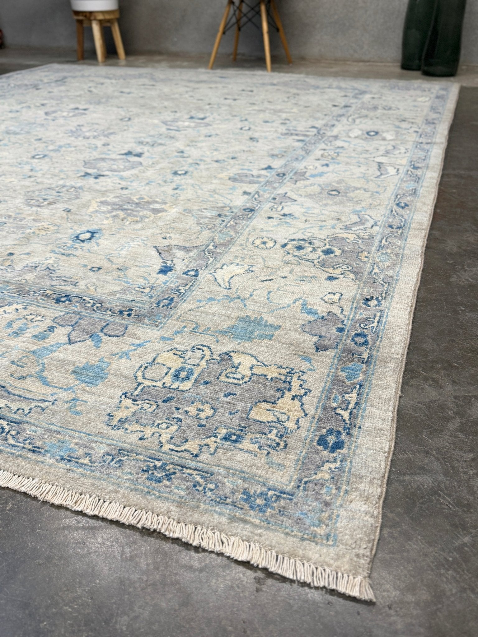 Neutral transitional handmade 8x10 decorative rug with muted gray, ivory, and layered blue tones. Soft Sultanabad-inspired floral motifs, perfect for living rooms, dining spaces, or bedrooms. Contemporary yet timeless, from a rug shop in Burlingame, San Francisco Bay Area, CA with free shipping.