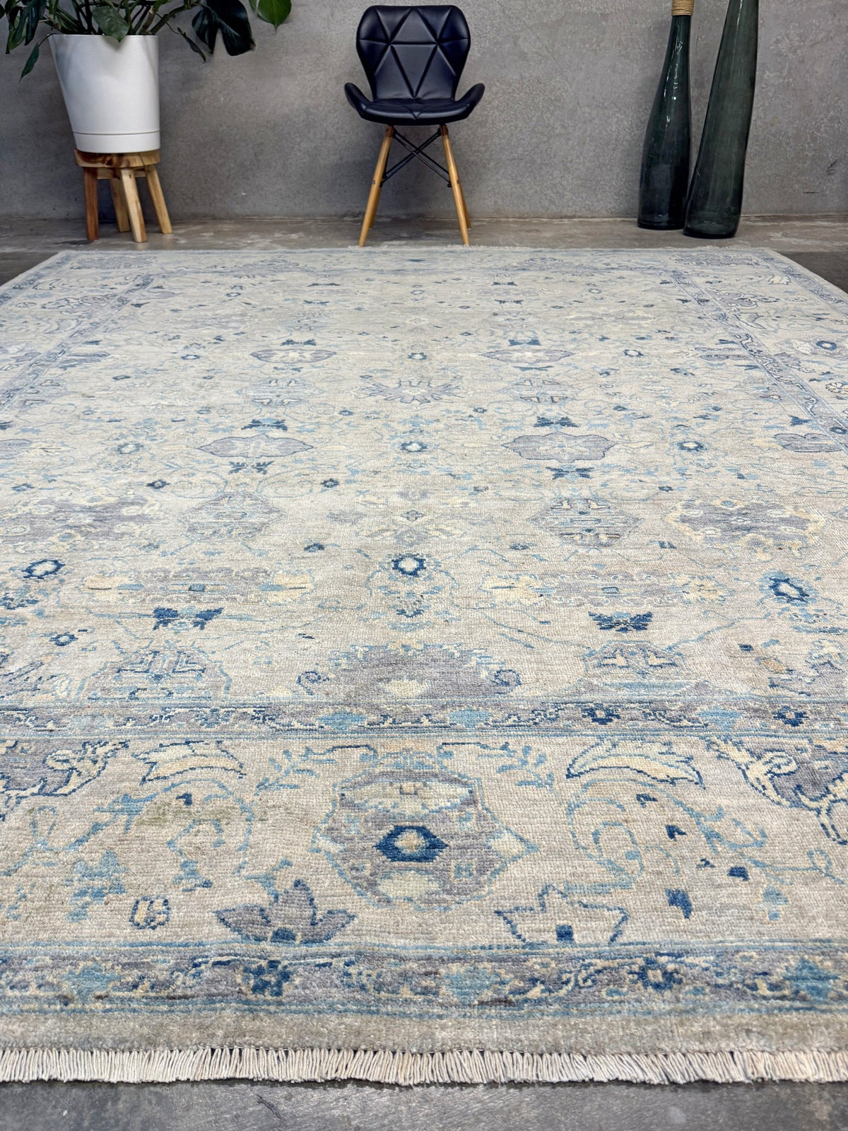 Neutral blue Oushak Turkish rug with ivory and pale blue-gray field, soft floral motifs, muted border, beige and deeper blue accents, handmade wool 8x10 from Indigo Rugs Burlingame Bay Area.