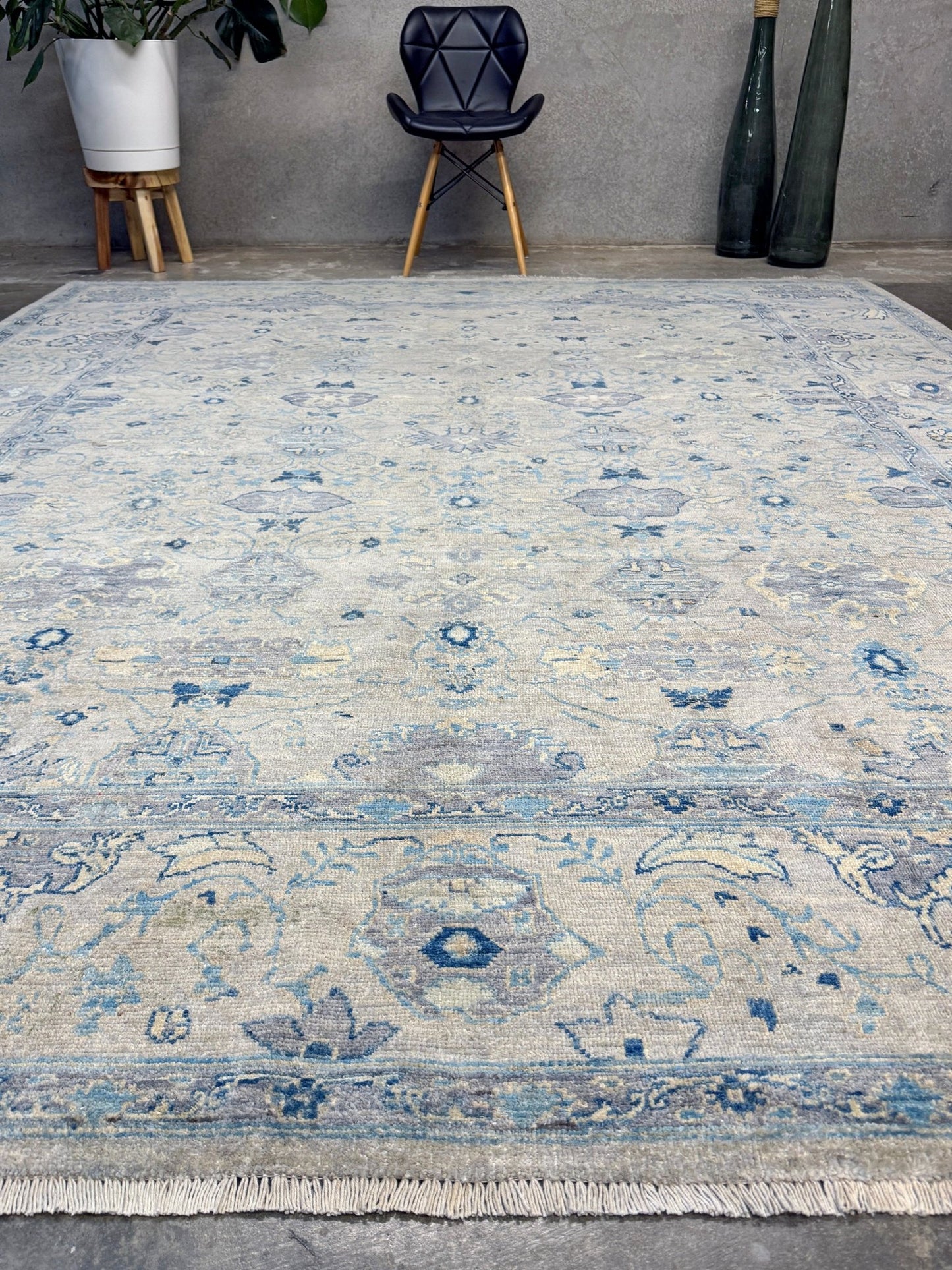 Neutral transitional handmade 8x10 rug with muted gray, ivory, and layered blue tones. Soft Sultanabad-inspired floral motifs, perfect for living rooms, dining spaces, or bedrooms. Contemporary yet timeless, from a rug shop in Burlingame, San Francisco Bay Area, CA with free shipping.