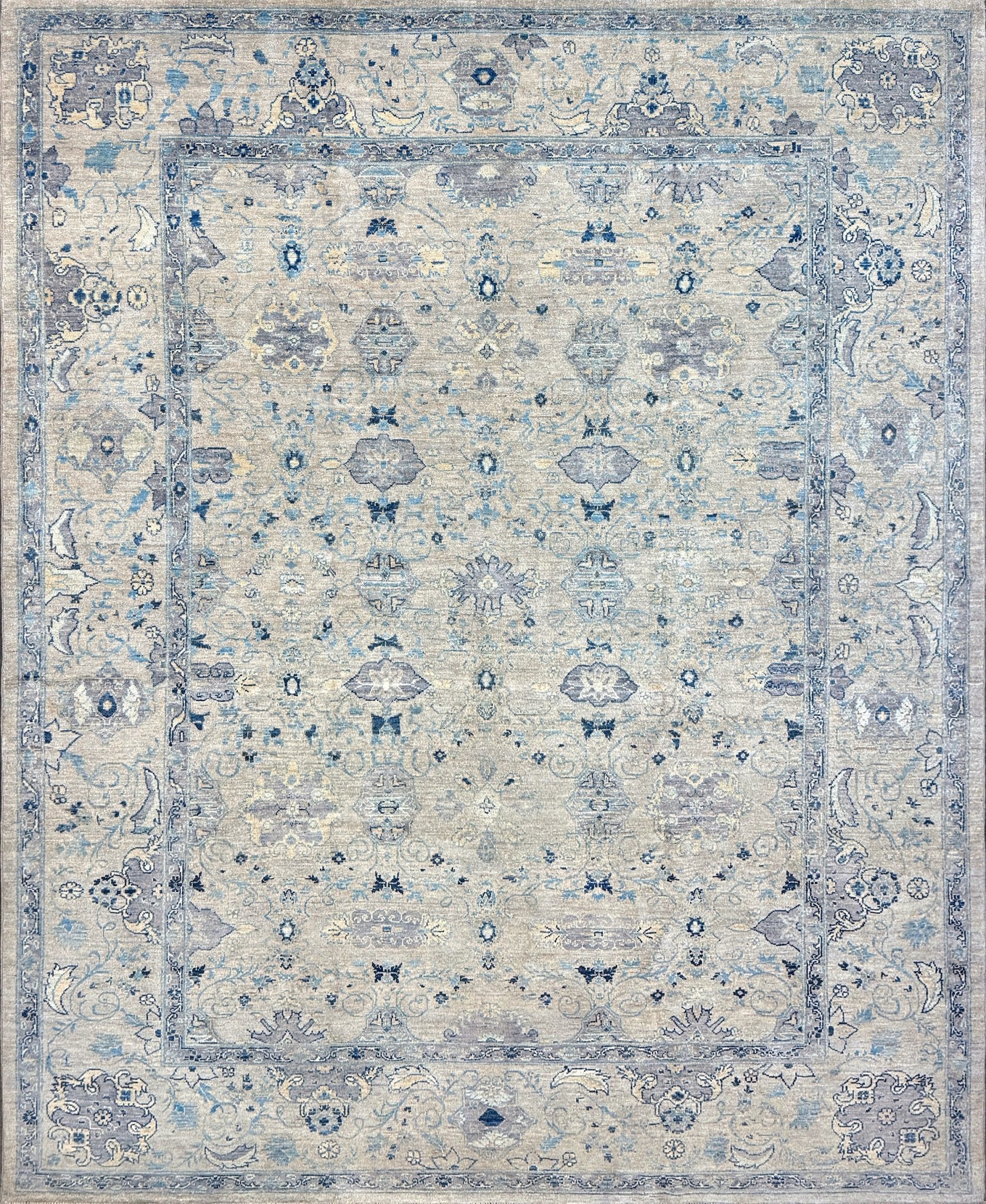 Neutral transitional handmade 8x10 rug with muted gray, ivory, and layered blue tones. Soft Sultanabad-inspired floral motifs, perfect for living rooms, dining spaces, or bedrooms. Contemporary yet timeless, from a rug shop in Burlingame, San Francisco Bay Area, CA with free shipping.