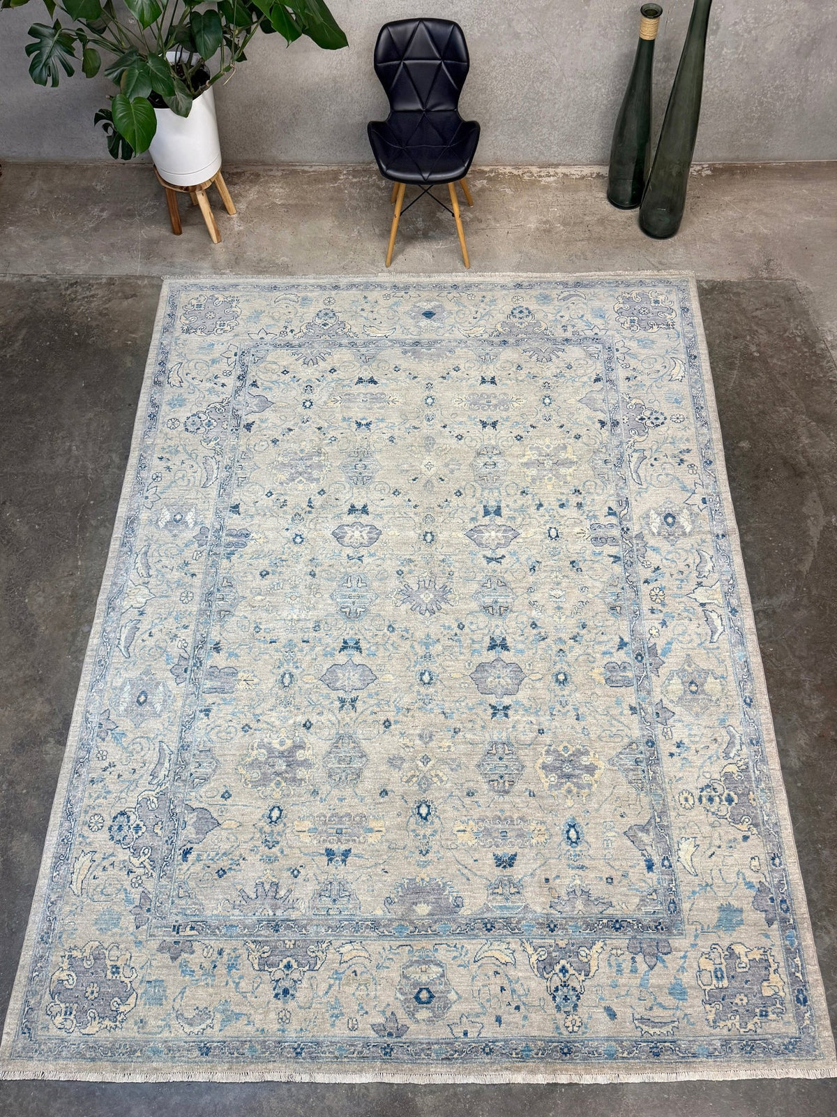 Neutral blue Oushak Turkish rug with ivory and pale blue-gray field, soft floral motifs, muted border, beige and deeper blue accents, handmade wool 8x10 from Indigo Rugs Burlingame Bay Area.