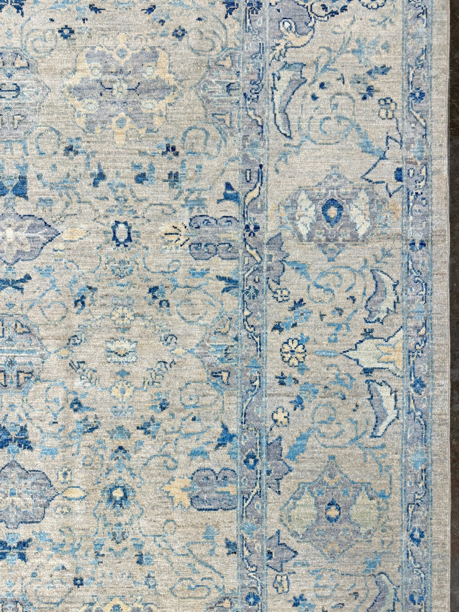 Neutral transitional handmade 8x10 decorative rug with muted gray, ivory, and layered blue tones. Soft Sultanabad-inspired floral motifs, perfect for living rooms, dining spaces, or bedrooms. Contemporary yet timeless, from a rug shop in Burlingame, San Francisco Bay Area, CA with free shipping.