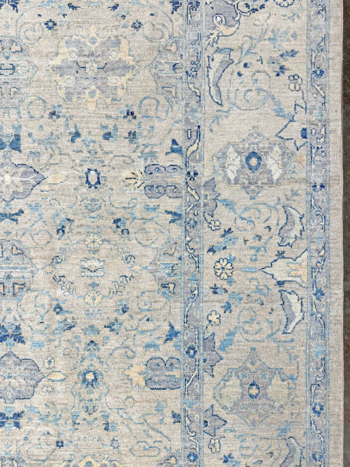 Neutral blue Oushak Turkish rug with ivory and pale blue-gray field, soft floral motifs, muted border, beige and deeper blue accents, handmade wool 8x10 from Indigo Rugs Burlingame Bay Area.