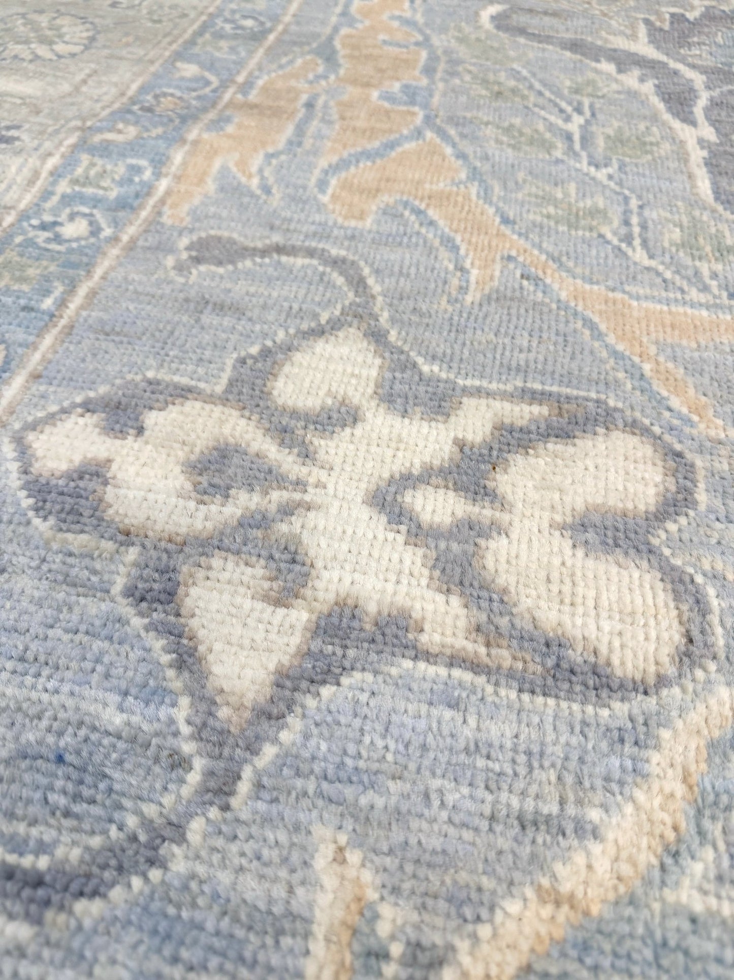 Close up of 8x10 handmade transitional Bijar design rug in muted blue and gray tones with ivory, sage, wheat, and navy accents. Neutral, calming, and elegant—perfect for modern, coastal, or rustic home décor. Available from Indigo Rugs, a handmade rug shop in Burlingame, San Francisco Bay Area, CA. Free shipping in the U.S.