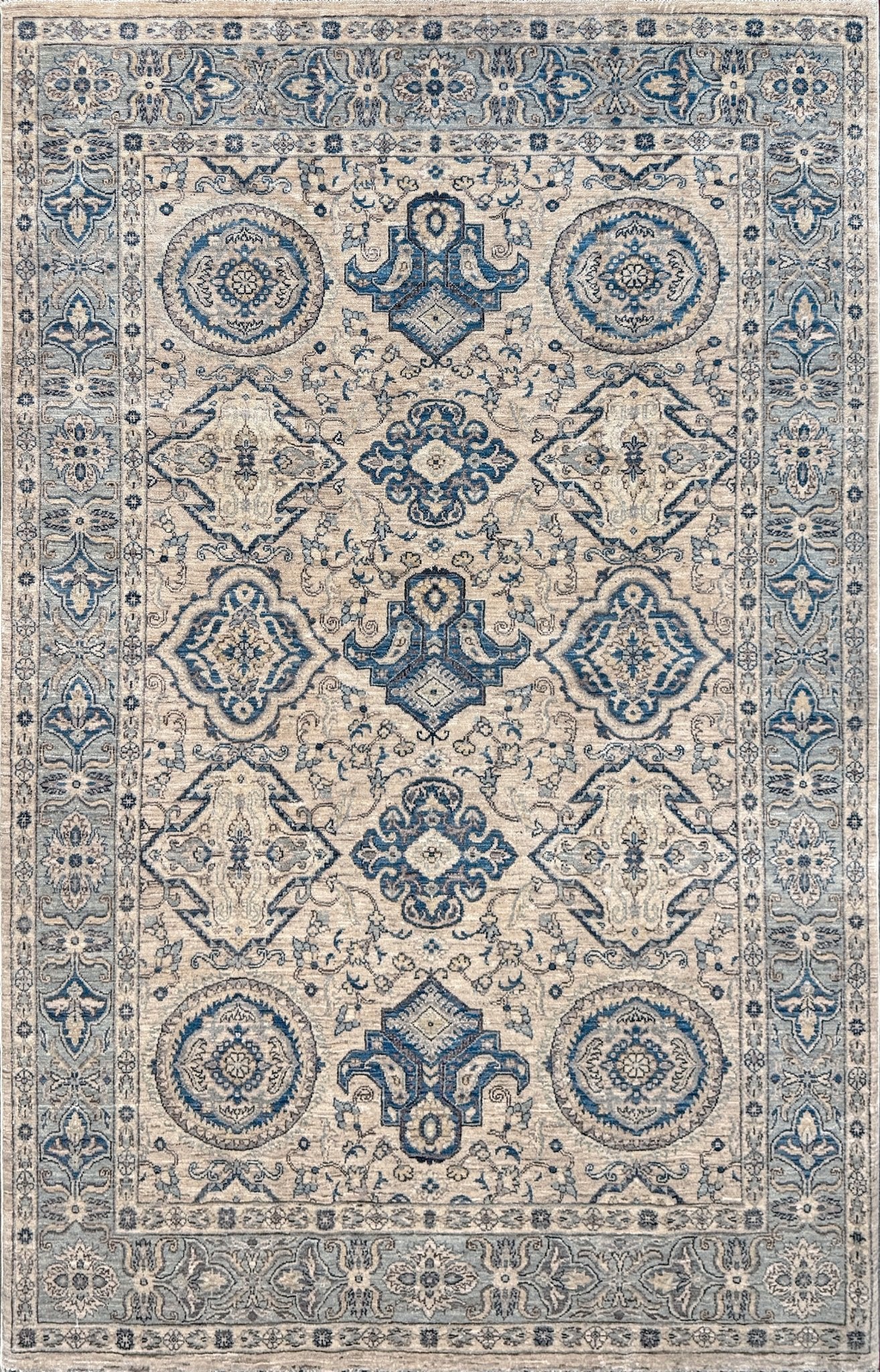 6x9 handmade transitional Ziegler Sultanabad Turkish rug in soft ivory, beige, and muted blue tones with a neutral, calming palette. Ideal for living rooms, dining rooms, and bedrooms in modern, rustic, or coastal décor. From a rug shop in Burlingame, San Francisco Bay Area, CA with free shipping.