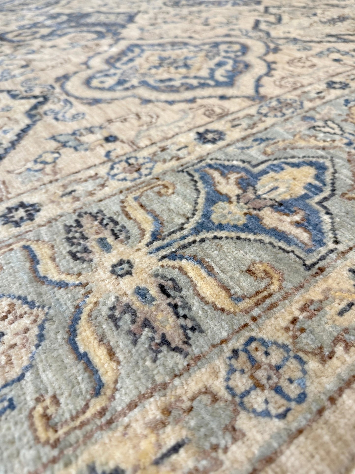 6x9 handmade transitional Ziegler Sultanabad Turkish rug in soft ivory, beige, and muted blue tones with a neutral, calming palette. Ideal for living rooms, dining rooms, and bedrooms in modern, rustic, or coastal décor. From a rug shop in Burlingame, San Francisco Bay Area, CA with free shipping.