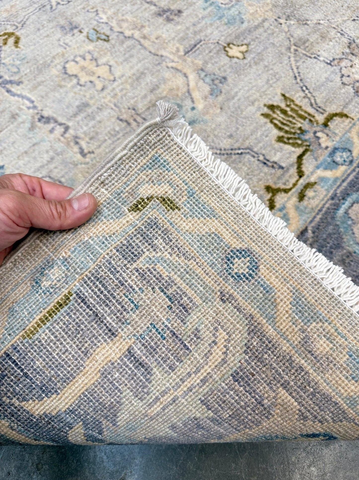Handmade transitional 6x9 Turkish Oushak rug in silvery gray, powder blue, ivory, olive green, and muted lavender. Perfect for coastal, farmhouse, or light modern interiors — available at Indigo Rugs, Burlingame CA. Free Shipping