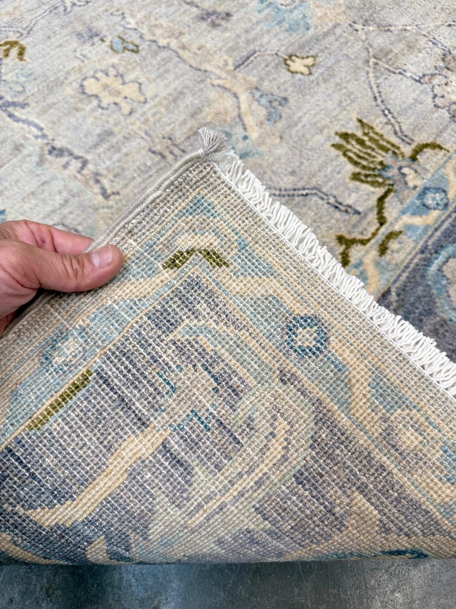 Handmade transitional 6x9 Turkish Oushak rug in silvery gray, powder blue, ivory, olive green, and muted lavender. Perfect for coastal, farmhouse, or light modern interiors — available at Indigo Rugs, Burlingame CA. Free Shipping