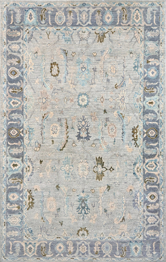 Handmade transitional 6x9 Turkish Oushak rug in silvery gray, powder blue, ivory, olive green, and muted lavender. Perfect for coastal, farmhouse, or light modern interiors — available at Indigo Rugs, Burlingame.