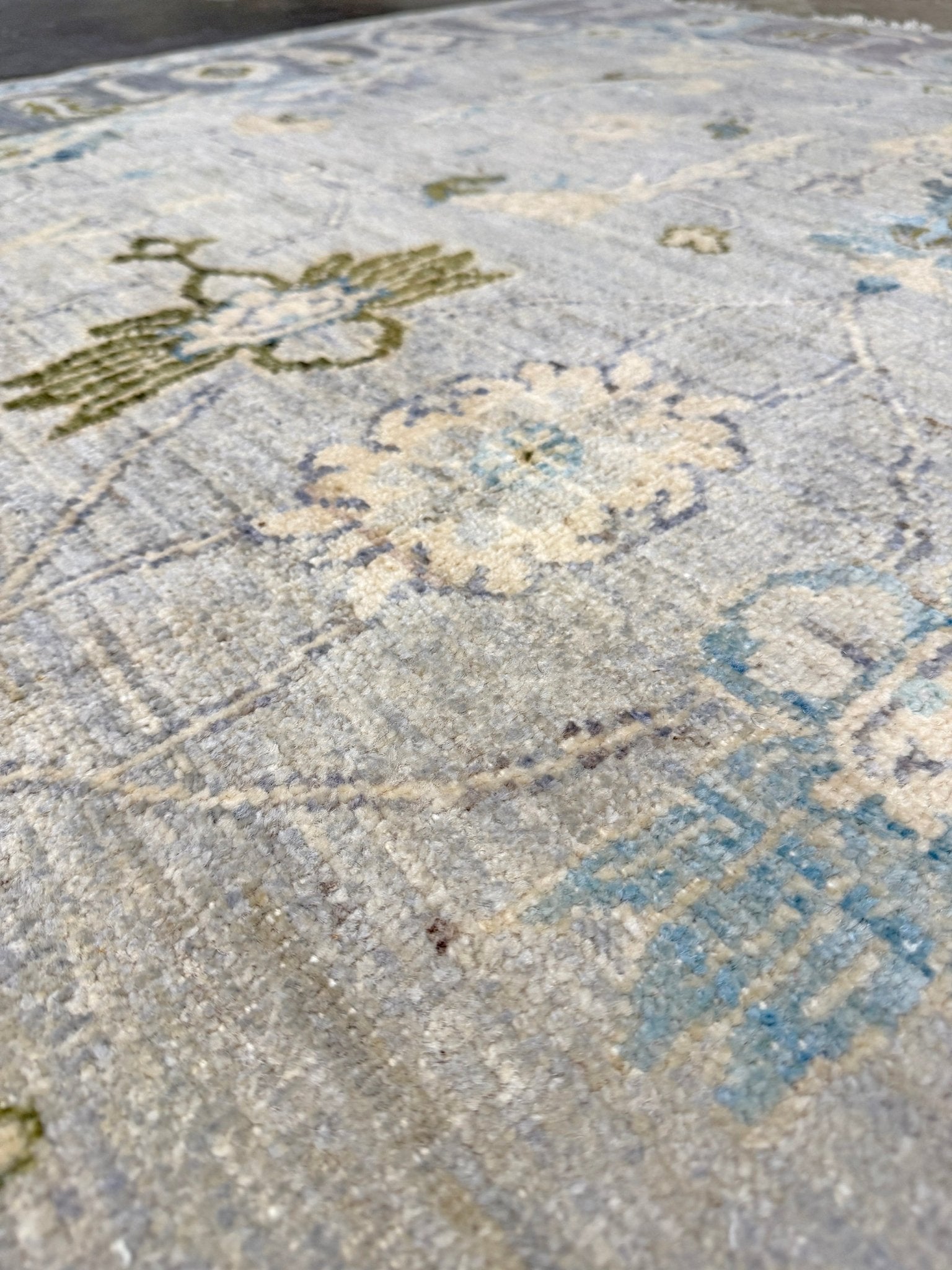 Handmade transitional 6x9 Turkish Oushak rug in silvery gray, powder blue, ivory, olive green, and muted lavender. Perfect for coastal, farmhouse, or light modern interiors — available at Indigo Rugs, Burlingame CA. Free Shipping