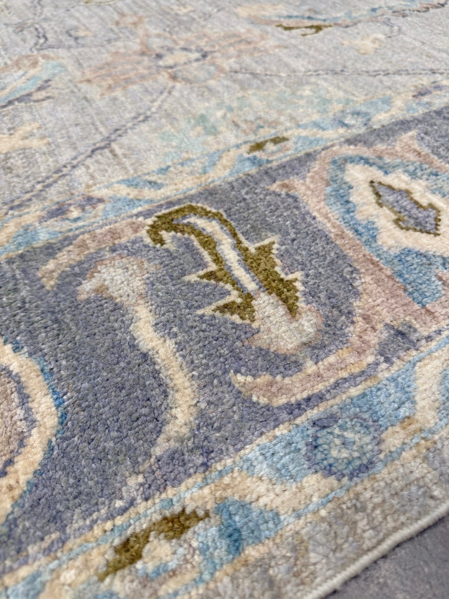 Handmade transitional 6x9 Turkish Oushak rug in silvery gray, powder blue, ivory, olive green, and muted lavender. Perfect for coastal, farmhouse, or light modern interiors — available at Indigo Rugs, Burlingame CA. Free Shipping