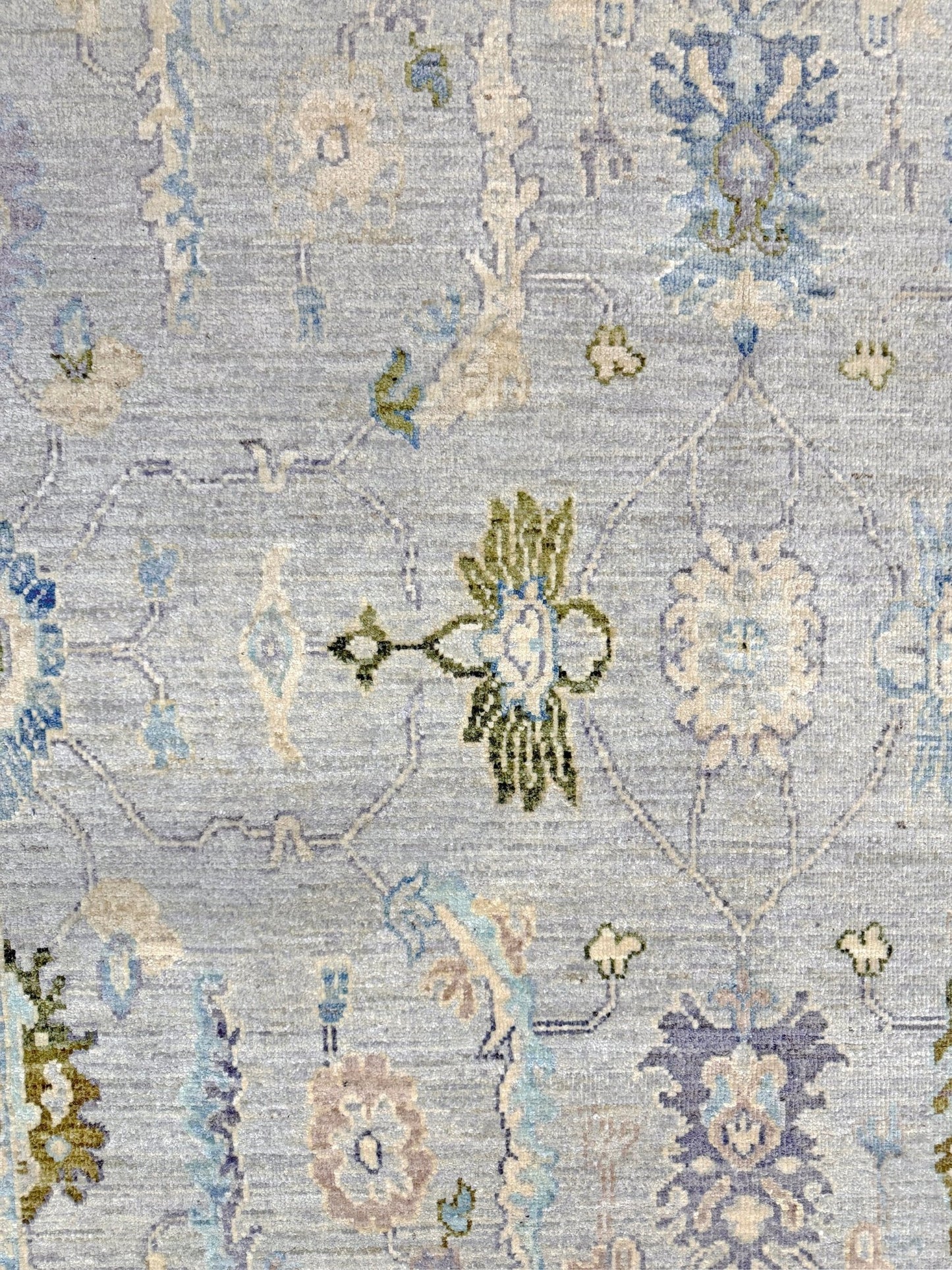 Handmade transitional 6x9 Turkish Oushak rug in silvery gray, powder blue, ivory, olive green, and muted lavender. Perfect for coastal, farmhouse, or light modern interiors — available at Indigo Rugs, Burlingame CA. Free Shipping
