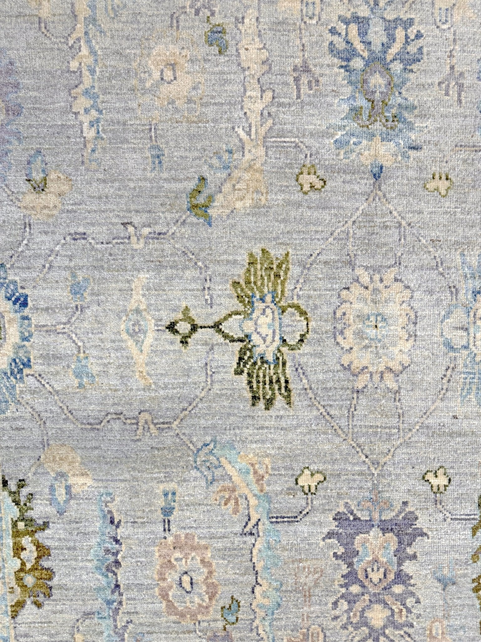 Handmade transitional 6x9 Turkish Oushak rug in silvery gray, powder blue, ivory, olive green, and muted lavender. Perfect for coastal, farmhouse, or light modern interiors — available at Indigo Rugs, Burlingame CA. Free Shipping