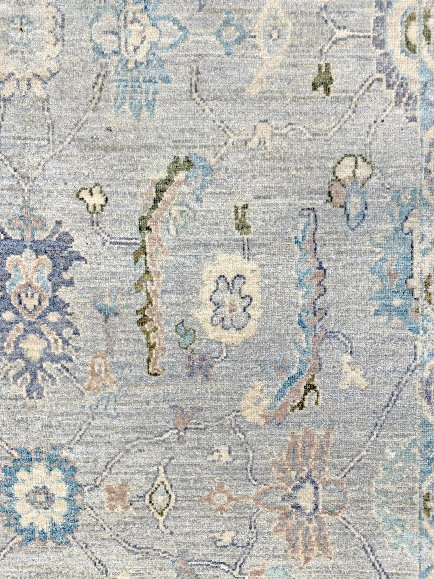 Handmade transitional 6x9 Turkish Oushak rug in silvery gray, powder blue, ivory, olive green, and muted lavender. Perfect for coastal, farmhouse, or light modern interiors — available at Indigo Rugs, Burlingame CA. Free Shipping