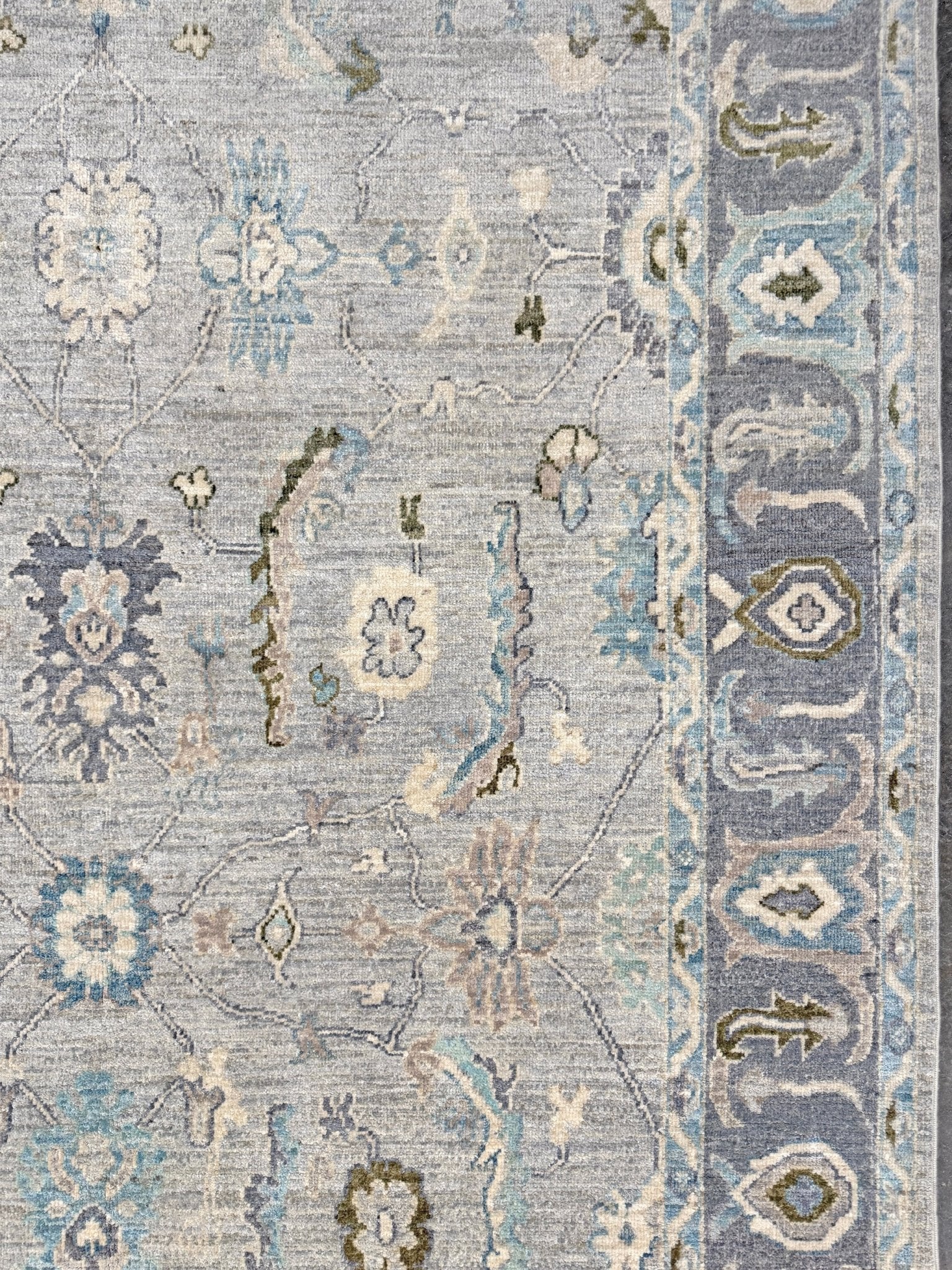 Handmade transitional 6x9 Turkish Oushak rug in silvery gray, powder blue, ivory, olive green, and muted lavender. Perfect for coastal, farmhouse, or light modern interiors — available at Indigo Rugs, Burlingame CA. Free Shipping