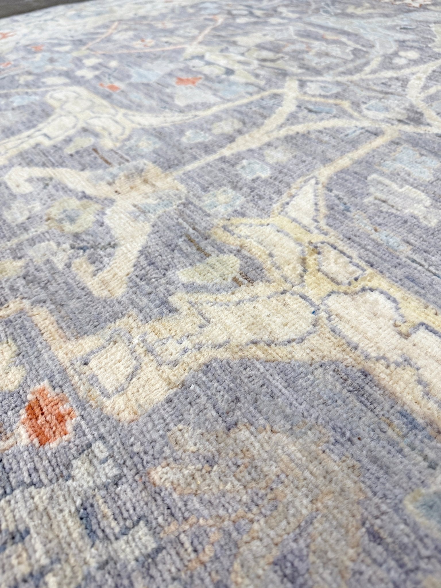 close-p of Neutral Handmade 6x9 Arabesque Bijar Persian rug in silvery gray with blue undertone, ivory vines, muted blue details, terracotta and rust highlights, and muted midnight blue outlines – transitional Persian wool rug for living room bedroom dining. Free shipping