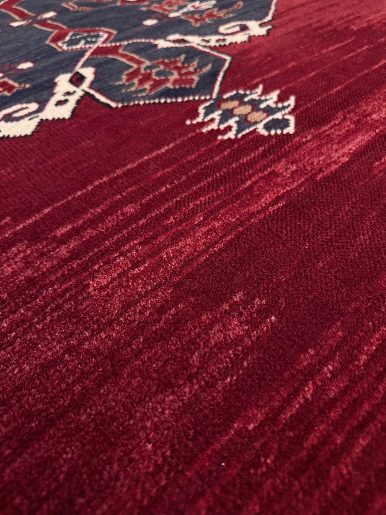 Close-up of a red patterned rug with intricate designs. Antique kiz bergama turkish rug 6x8 deep madder red field indigo clue medallion anatolian village rug 1920s indigo rugs san francisco bay area