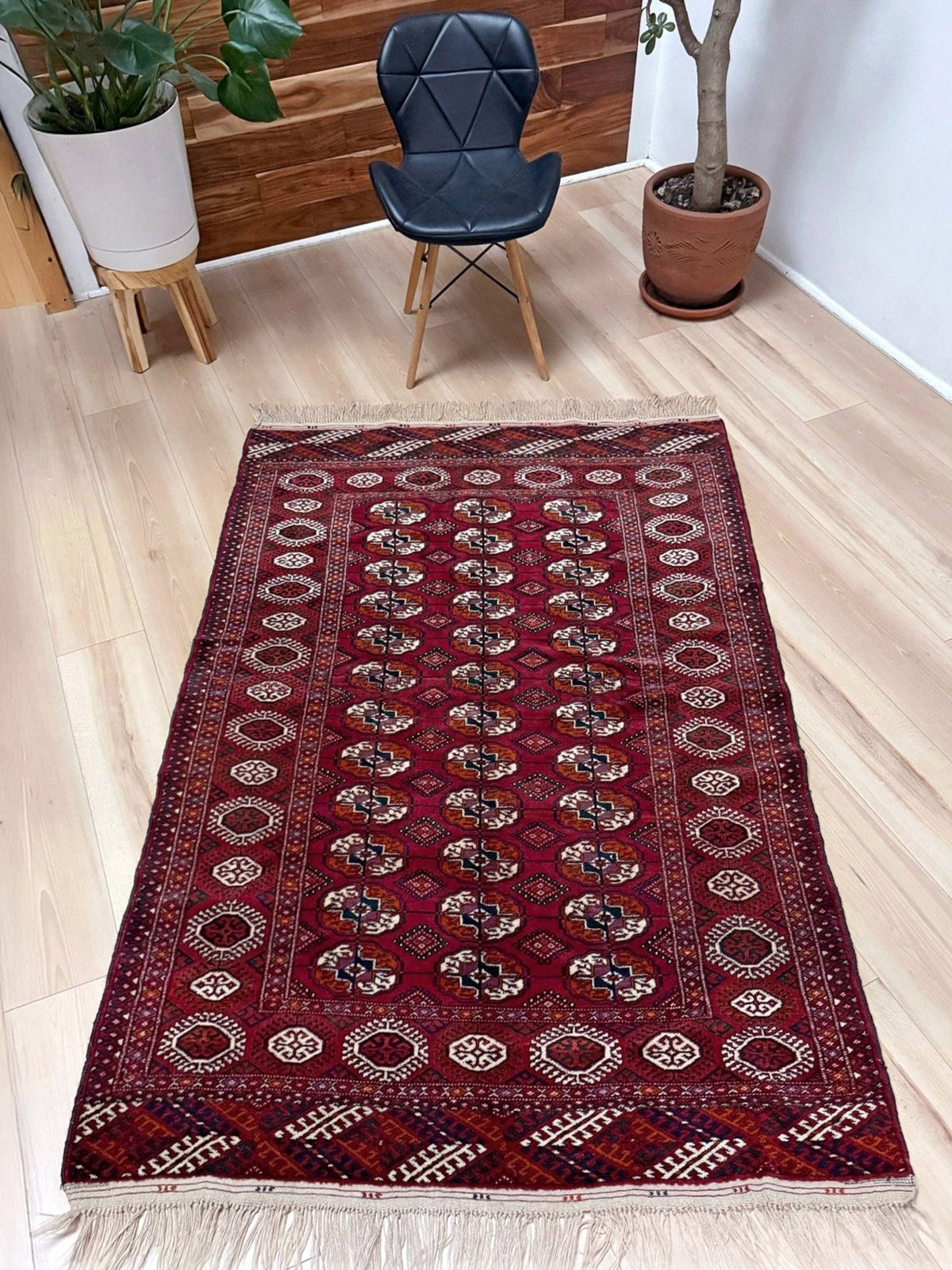 Vintage Turkmen Burgundy Bukhara rug 4x6 with repeating ivory gul motifs, velvety wool pile and classic tribal border. Hand-knotted wool scatter rug from Indigo Rugs, Burlingame — San Francisco Bay Area. Free shipping.