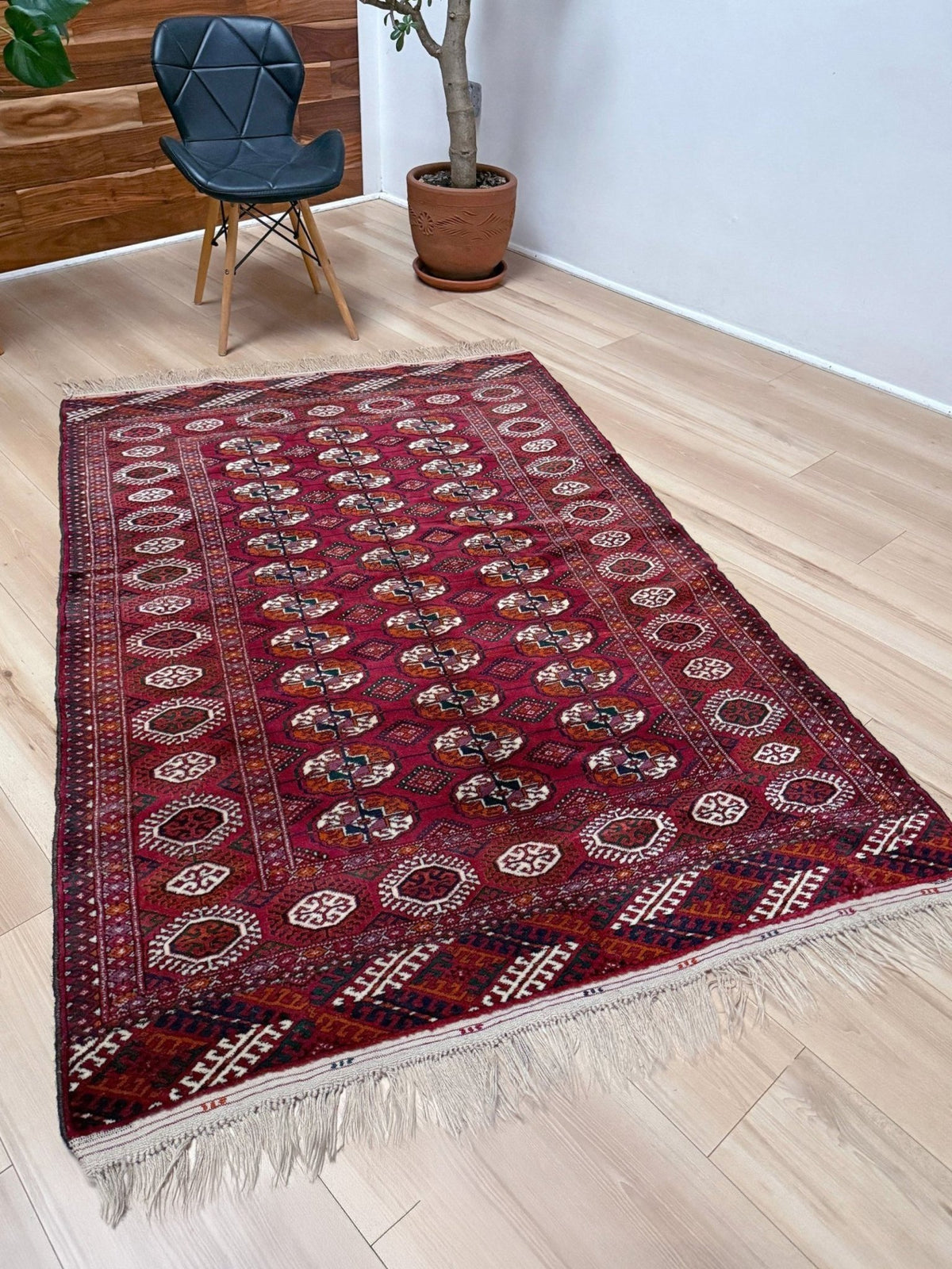 Vintage Turkmen Burgundy Bukhara rug 4x6 with repeating ivory gul motifs, velvety wool pile and classic tribal border. Hand-knotted wool scatter rug from Indigo Rugs, Burlingame — San Francisco Bay Area. Free shipping.