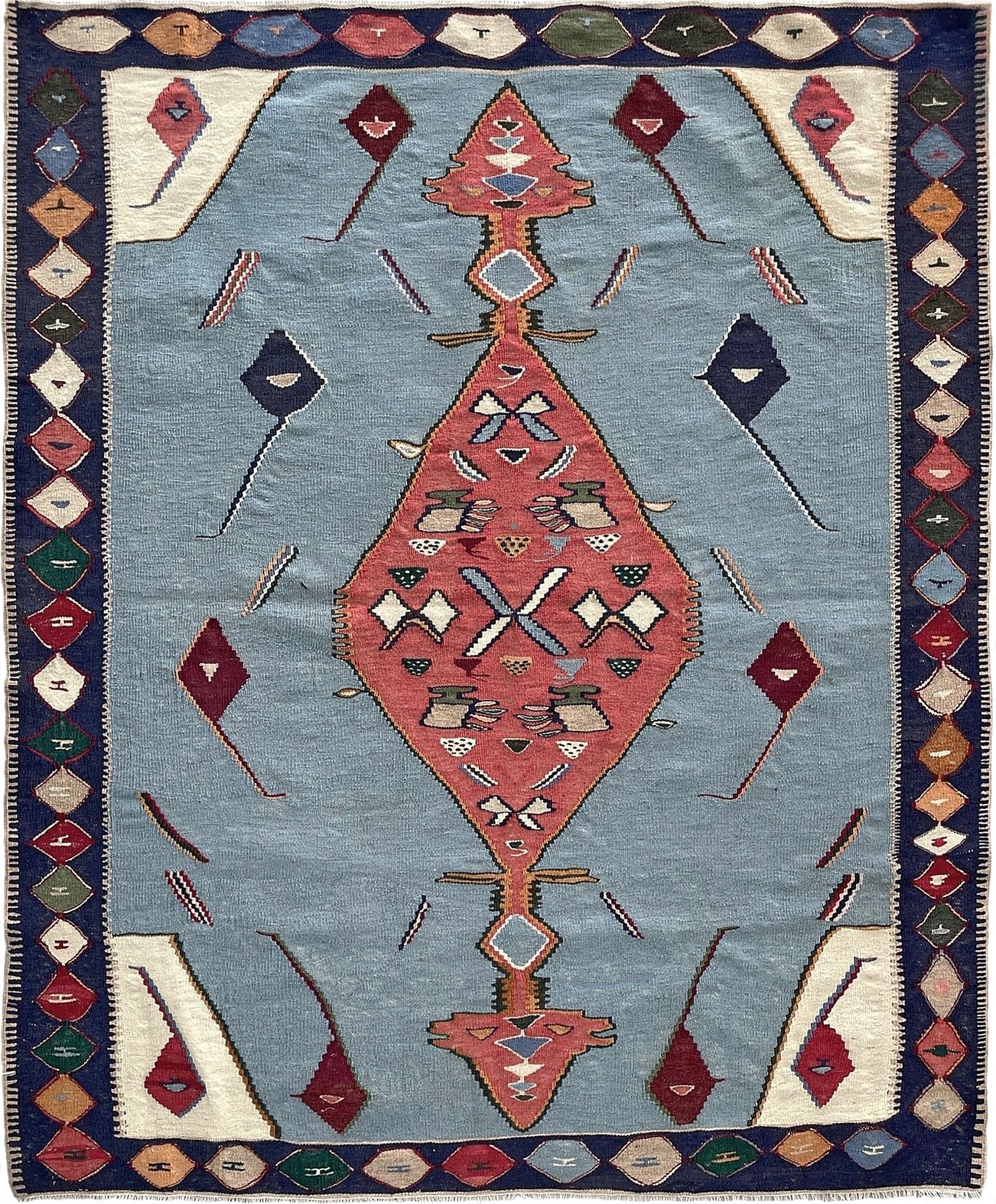 Decorative rug with geometric pattern on a blue background 4x5 persian senneh kilim rug. Kilim rug shop san francisco bay area