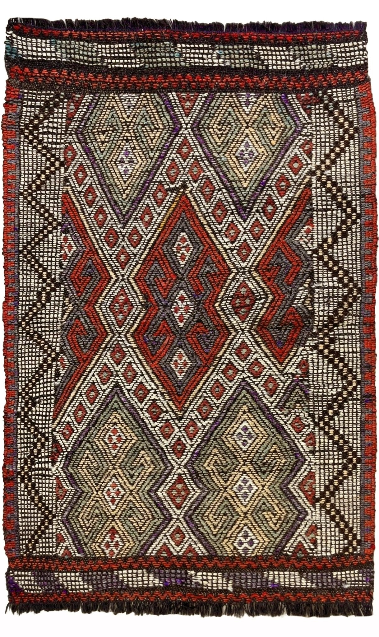 Traditional woven textile with geometric pattern and fringe details Small vintage Turkish cicim kilim rug, 2x4, with raised tribal embroidery in rust red, ivory, olive, and charcoal on a goat hair foundation.