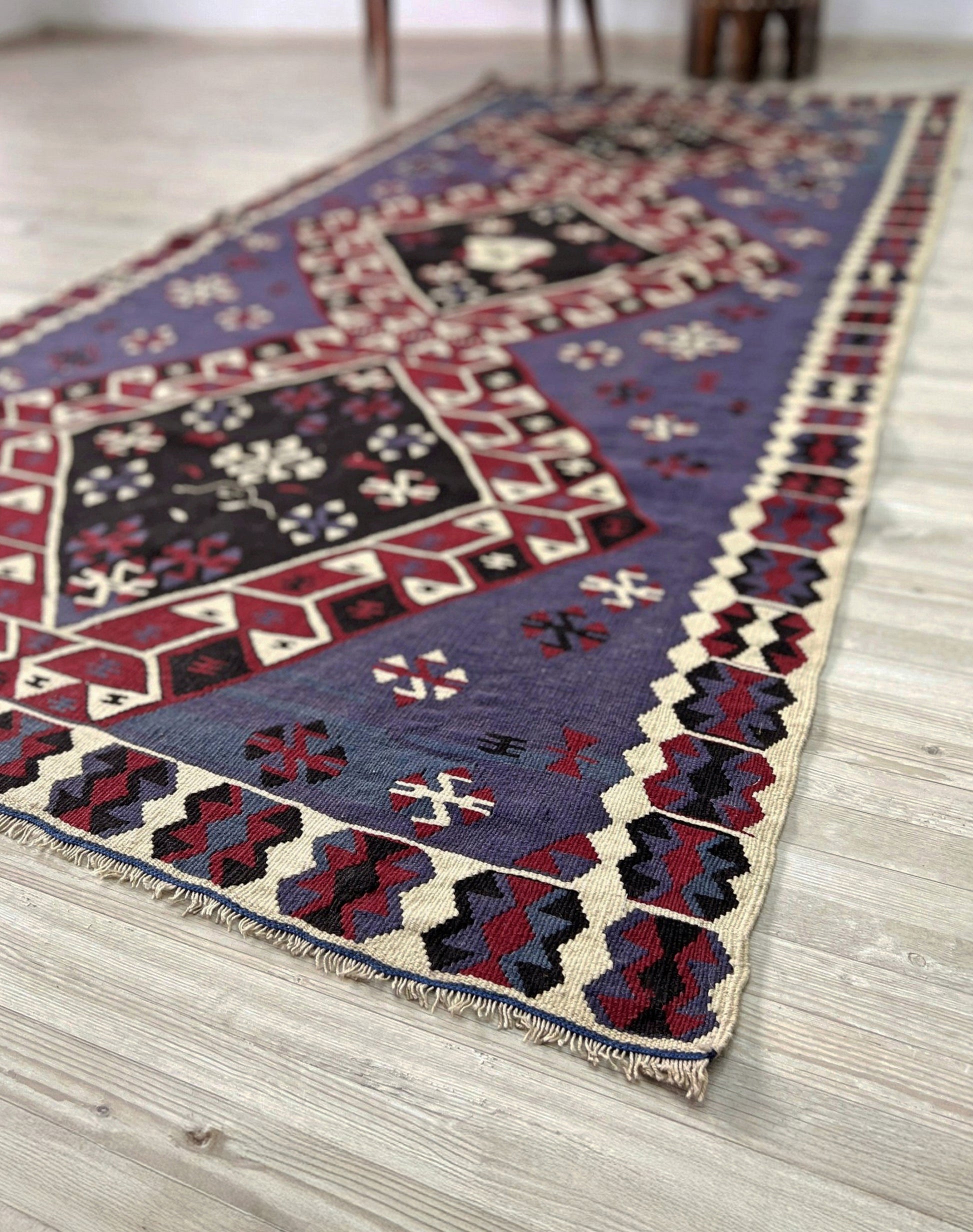 Violet blue Vintage Eastern Turkish kilim runner, 4x8, with bold geometric medallions in garnet red, ivory, navy, and black on a deep blue ground.