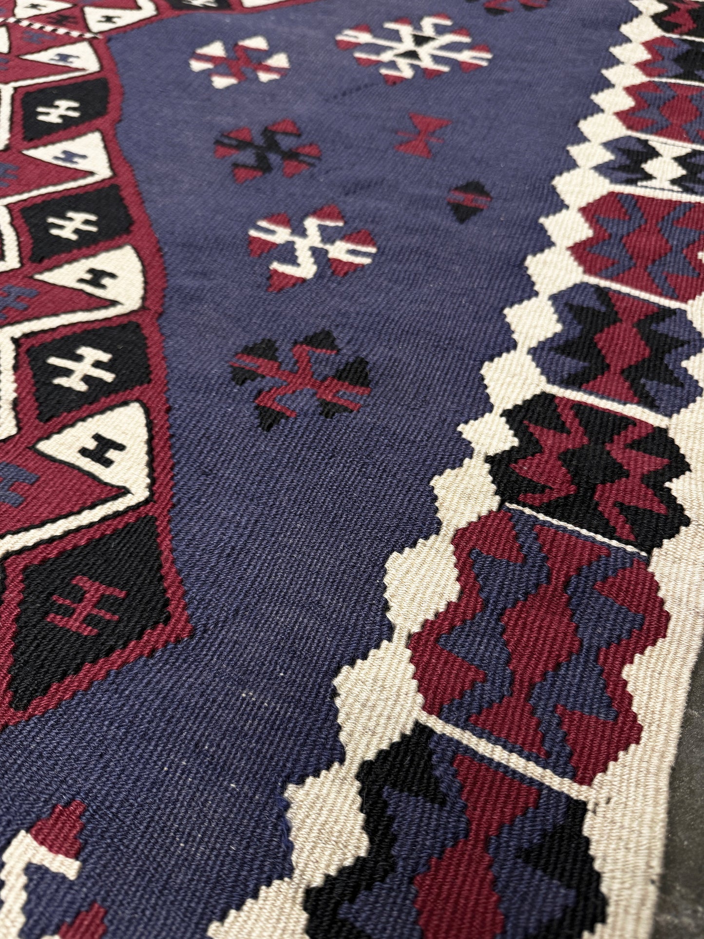 Violet blue Vintage Eastern Turkish kilim runner, 4x8, with bold geometric medallions in garnet red, ivory, navy, and black on a deep blue ground.