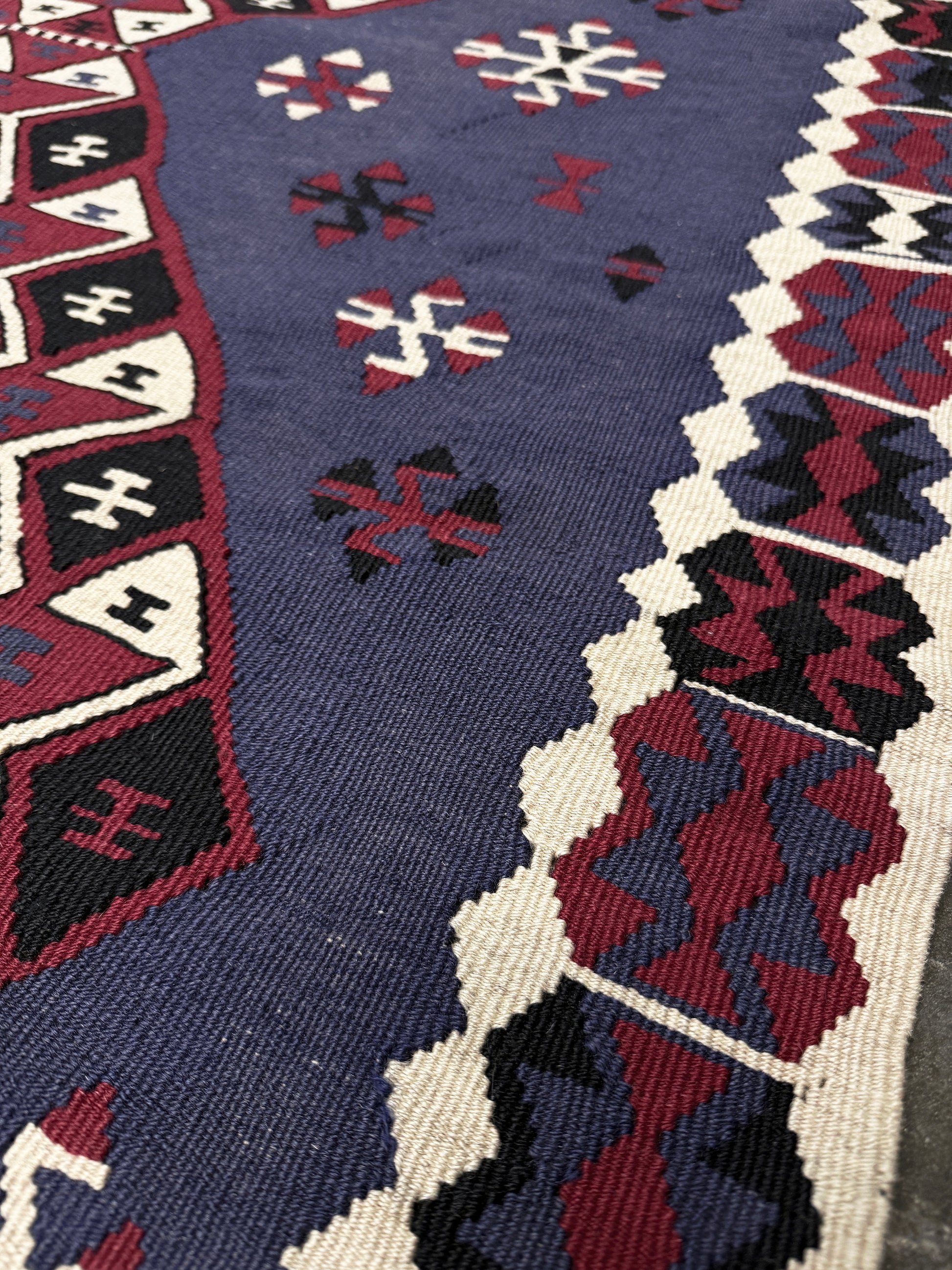 Violet blue Vintage Eastern Turkish kilim runner, 4x8, with bold geometric medallions in garnet red, ivory, navy, and black on a deep blue ground.
